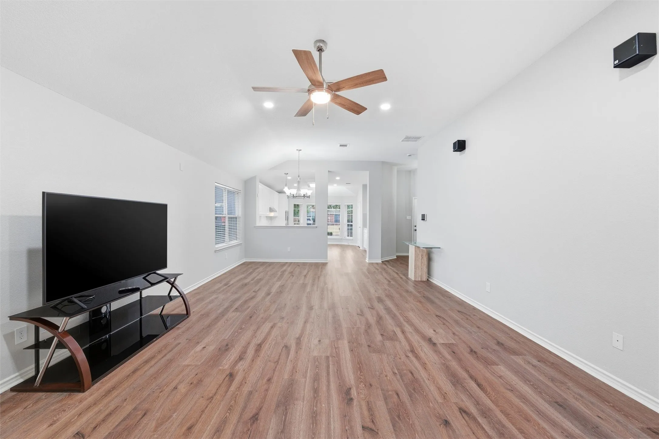 Open layout designed for everyday living and entertaining, with sightlines extending from the living room into the dining area and updated kitchen.
