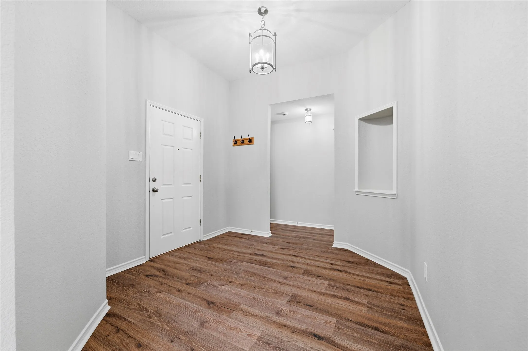 Bright and spacious entry foyer welcomes  guests into this beautifully updated home.