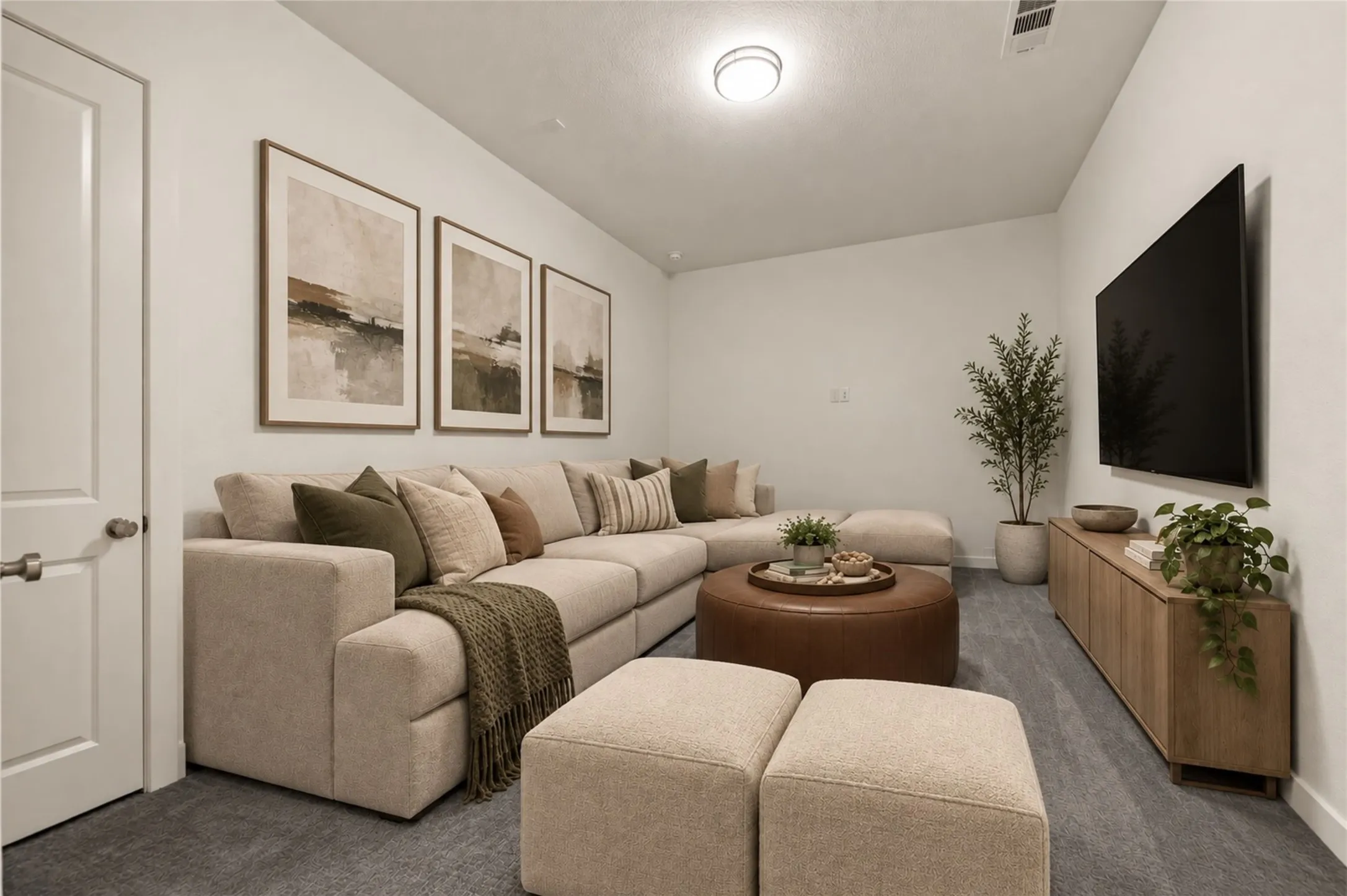 Recessed ceiling lighting, light gray wall-to-wall carpeting, and a white interior door