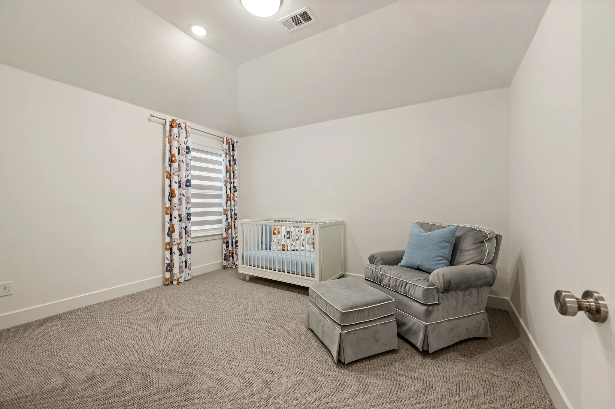 Vaulted ceiling, recessed lighting, window with blinds, and neutral carpeting