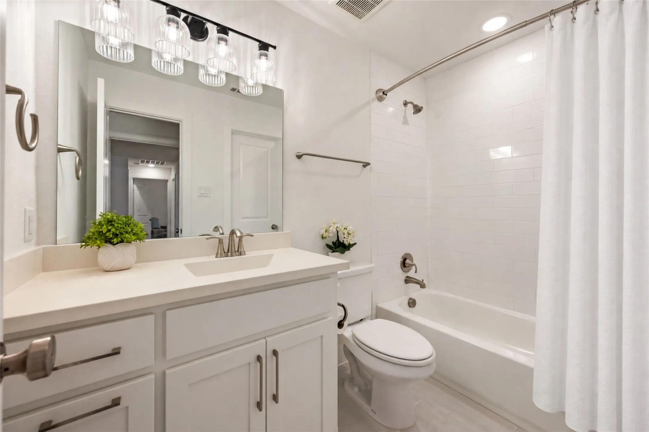 White subway tile shower surround with integrated soap dish