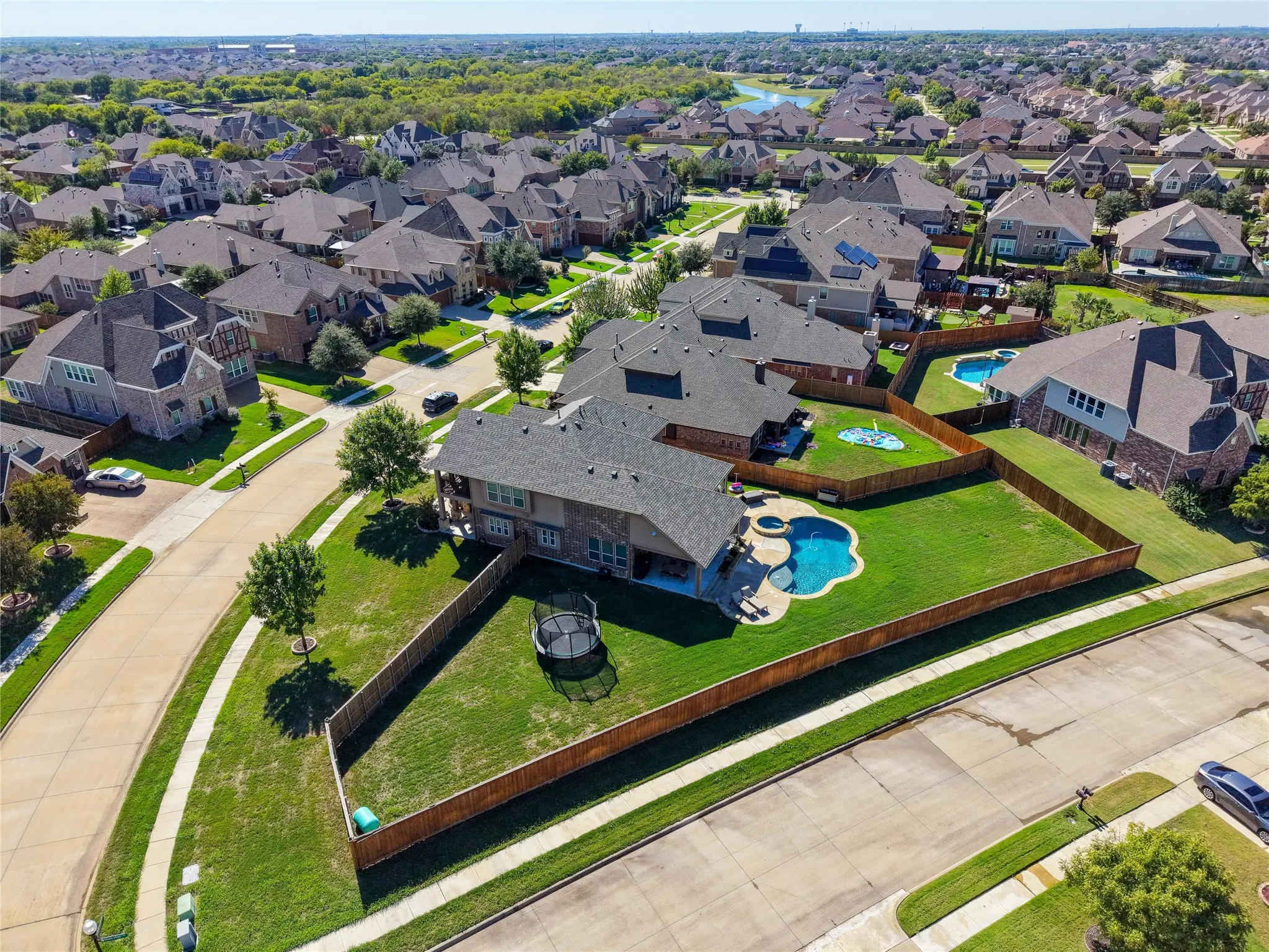 Overhead aerial showcasing the property's lot and backyard layout.