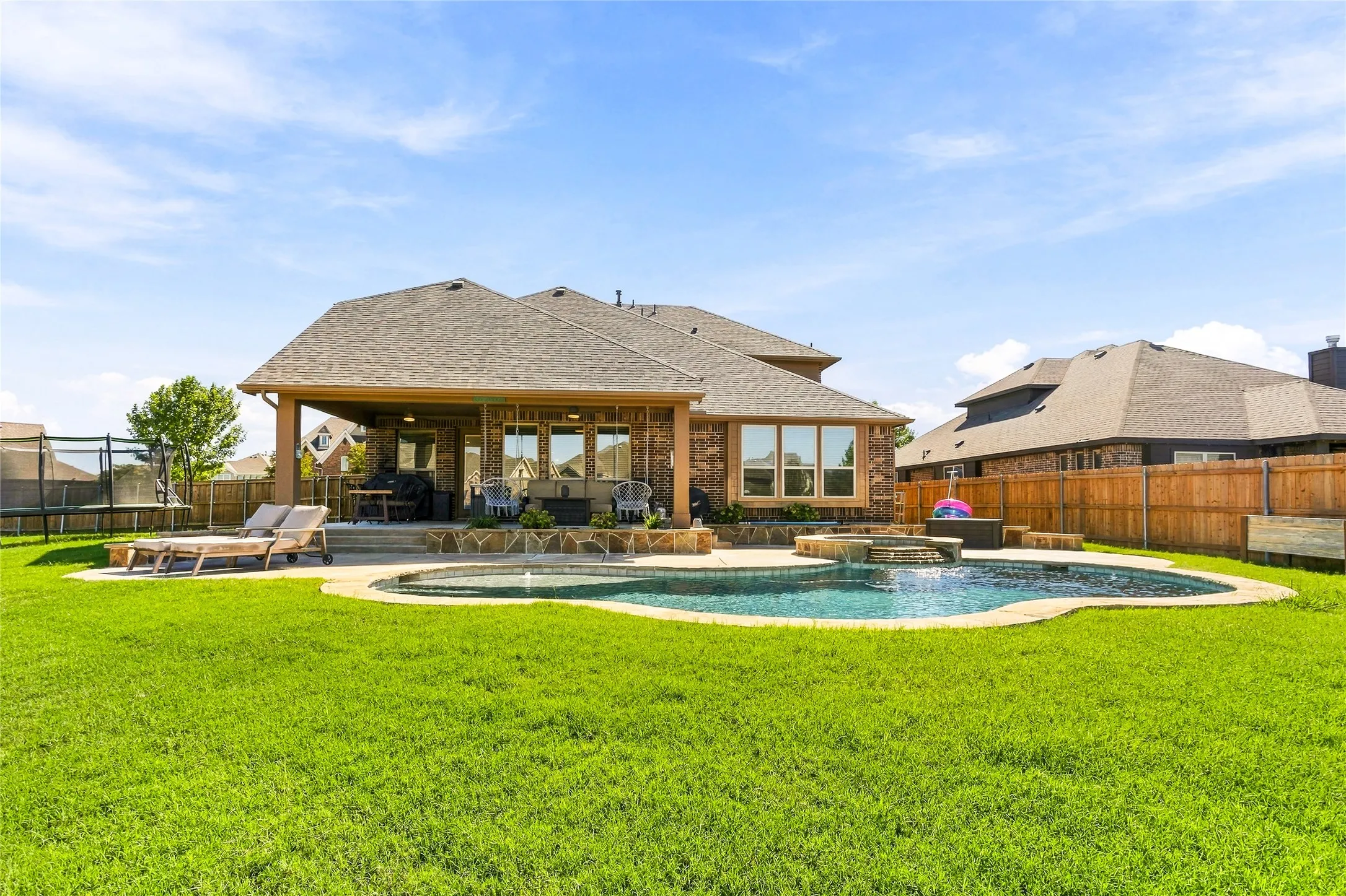 Beautiful rear elevation with a large backyard for outdoor enjoyment.