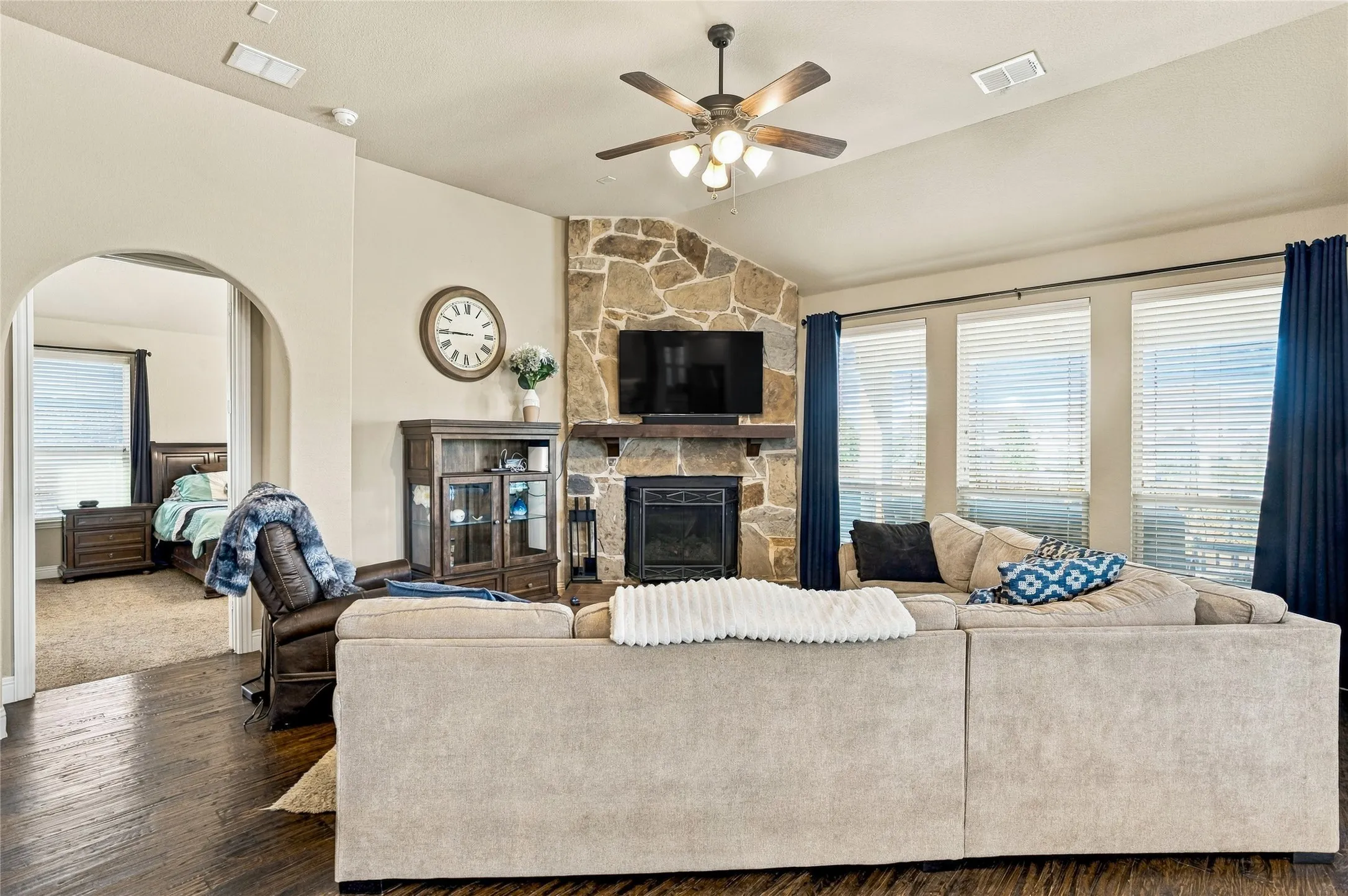 Comfortable living room with inviting fireplace and large windows.