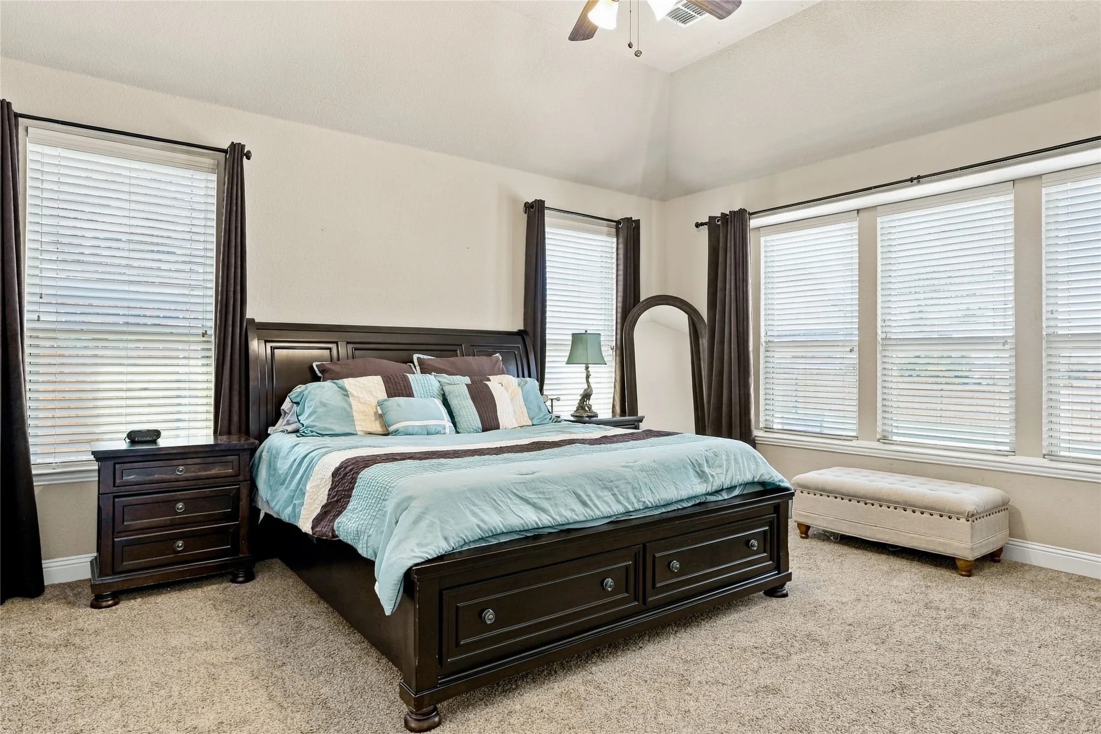Spacious primary bedroom with ample natural light.