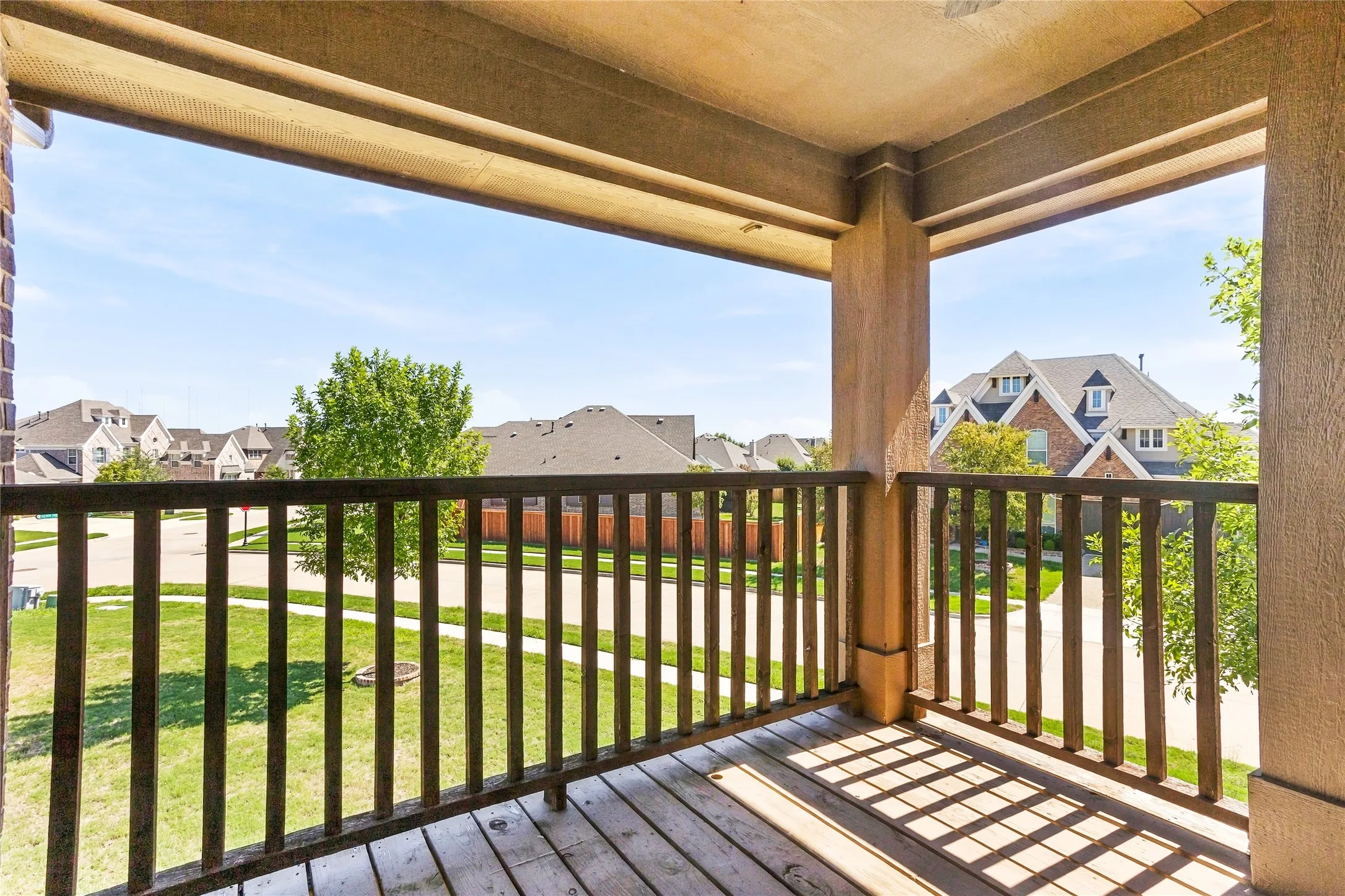 Covered balcony offering a peaceful outdoor retreat.