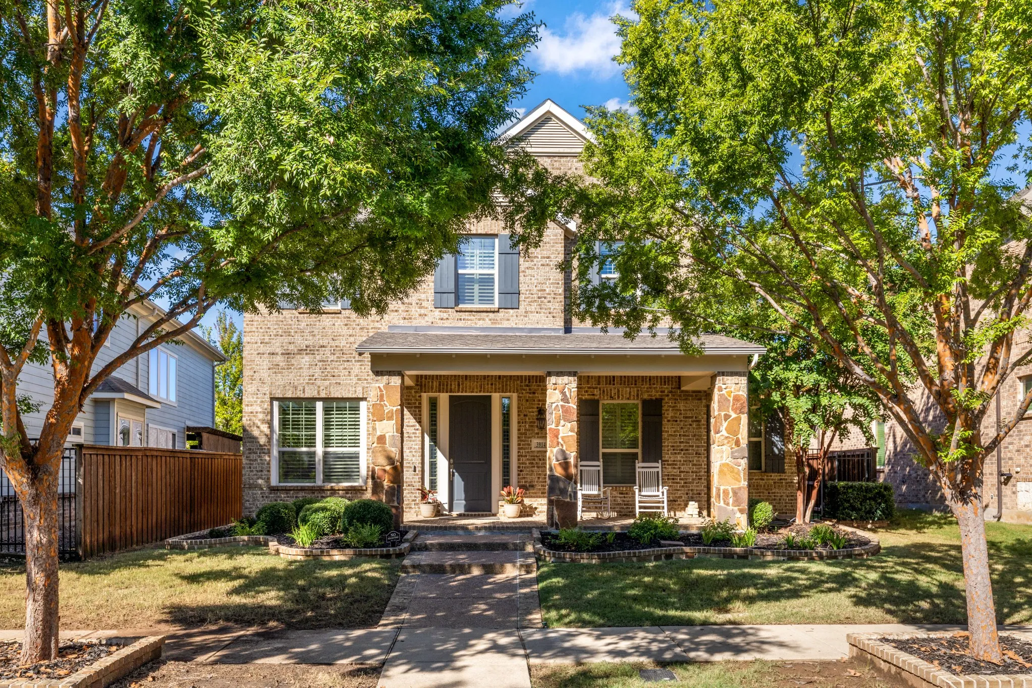 Brick and stone veneer exterior with a covered porch
