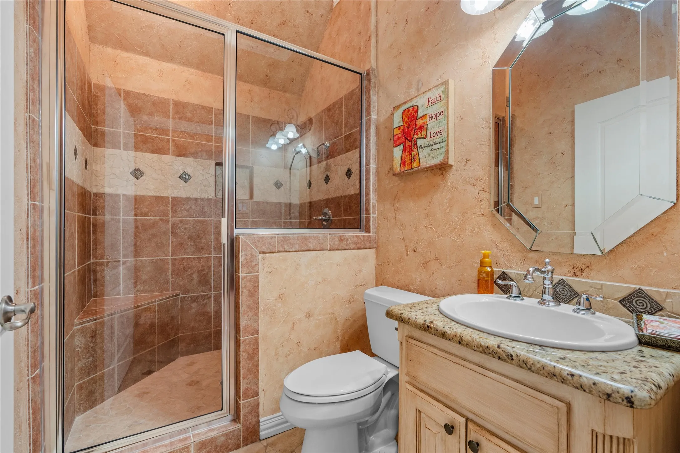 3rd Full bath Walk-in shower with glass enclosure and tile surround, granite counter at sink
