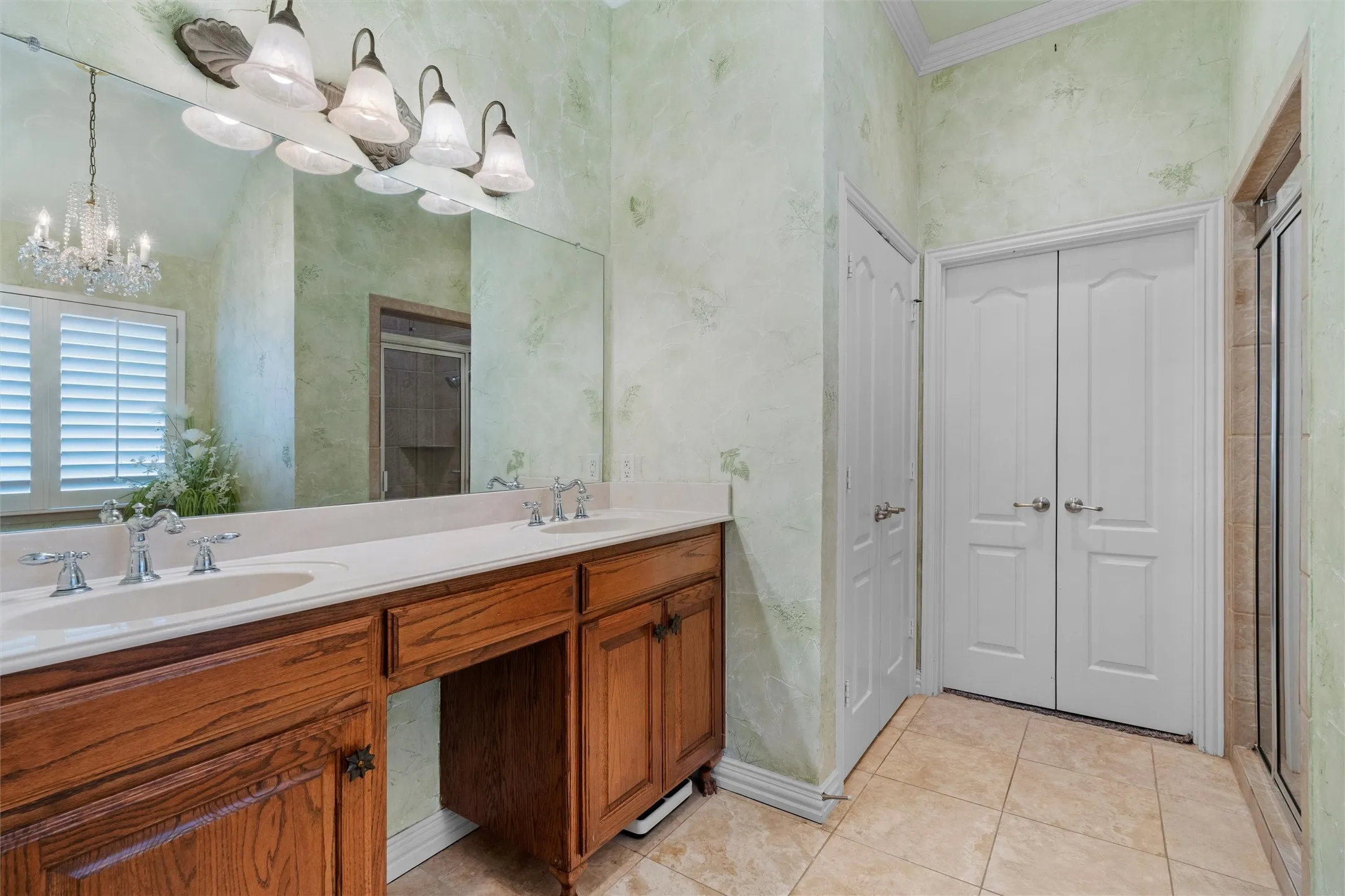 Primary Bath dual vanity with undermount sinks, wood cabinetry, and chrome fixtures