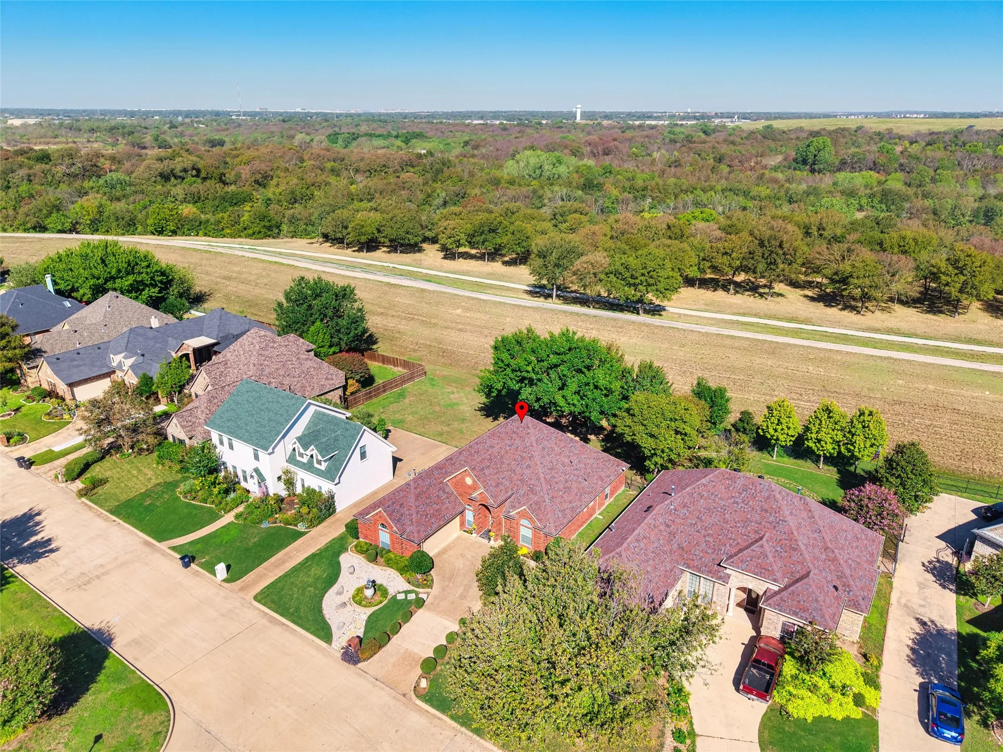 Aerial perspective showcasing residential properties adjacent to expansive natural areas