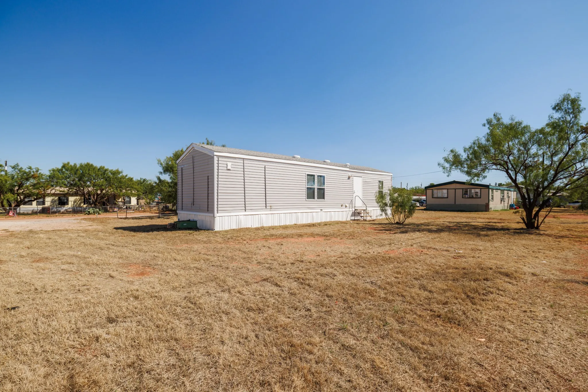 Mobile Home For Sale in Taylor County , 117 Seminole Street, Tye, Texas 79563, 2 Bedroom, 1 Bathroom, Garage spaces, 658 Sqft, built in 2017, mls#21400393, Real Estate Agent in Tye, Homes For Sale in Taylor county, Homes For Sale in Tye, Realtor in Tye Texas, Real Estate Brokerage Independent Realty Texas, Luminita Cordes Realtor
