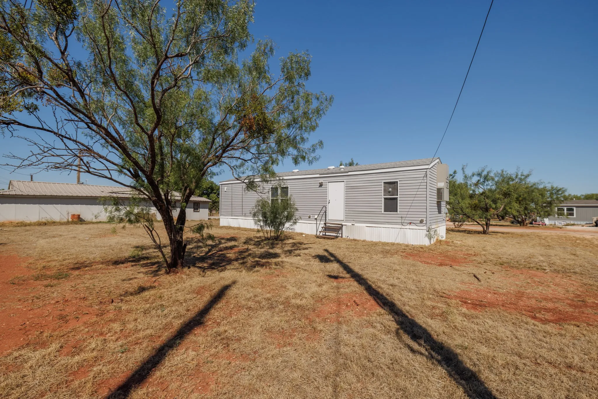 Mobile Home For Sale in Taylor County , 117 Seminole Street, Tye, Texas 79563, 2 Bedroom, 1 Bathroom, Garage spaces, 658 Sqft, built in 2017, mls#21400393, Real Estate Agent in Tye, Homes For Sale in Taylor county, Homes For Sale in Tye, Realtor in Tye Texas, Real Estate Brokerage Independent Realty Texas, Luminita Cordes Realtor