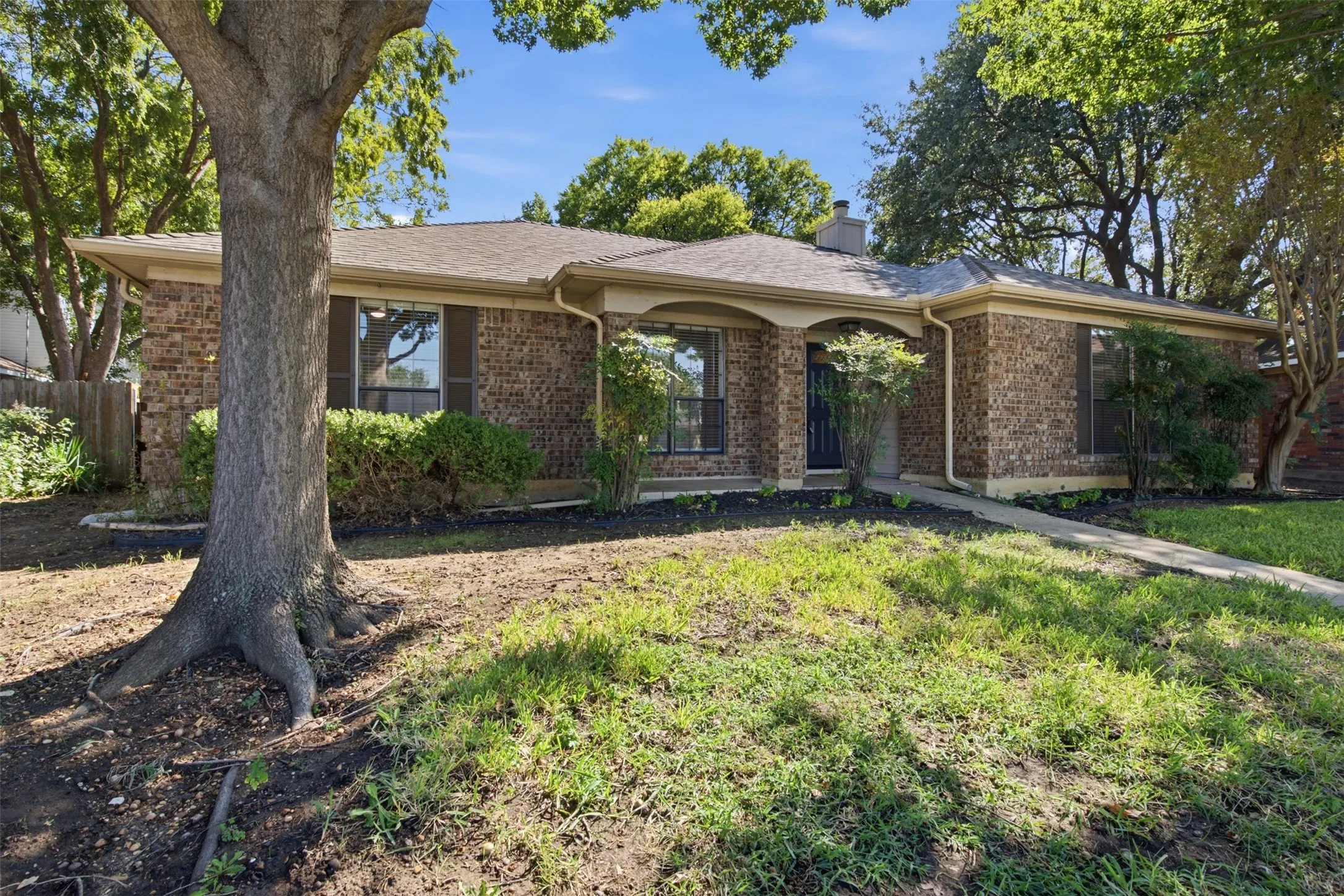 Brick exterior construction with an arched entryway