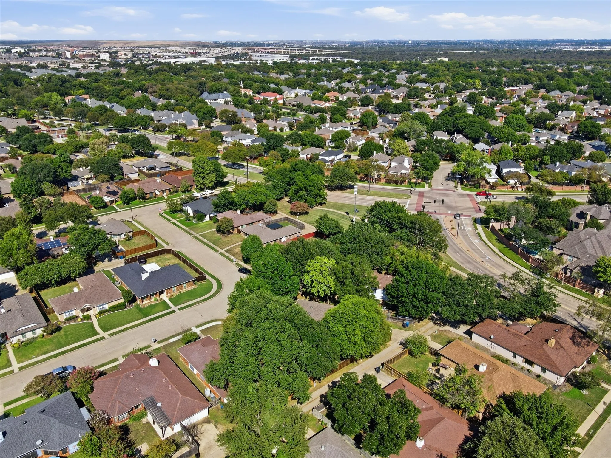 Established residential neighborhood featuring tree-lined streets, single-family homes with varied architectural styles, and mature landscaping throughout the community