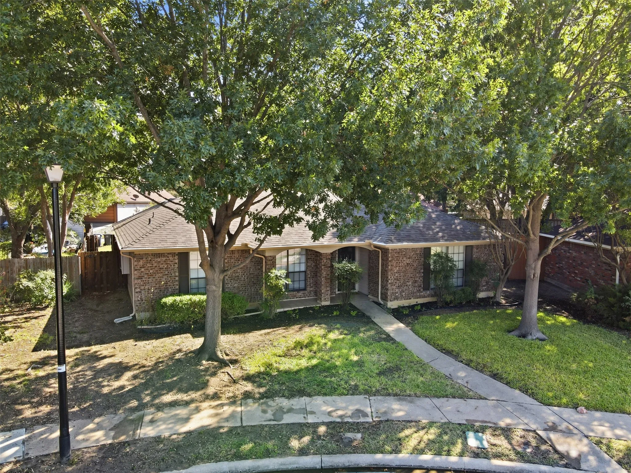 Brick exterior with mature trees