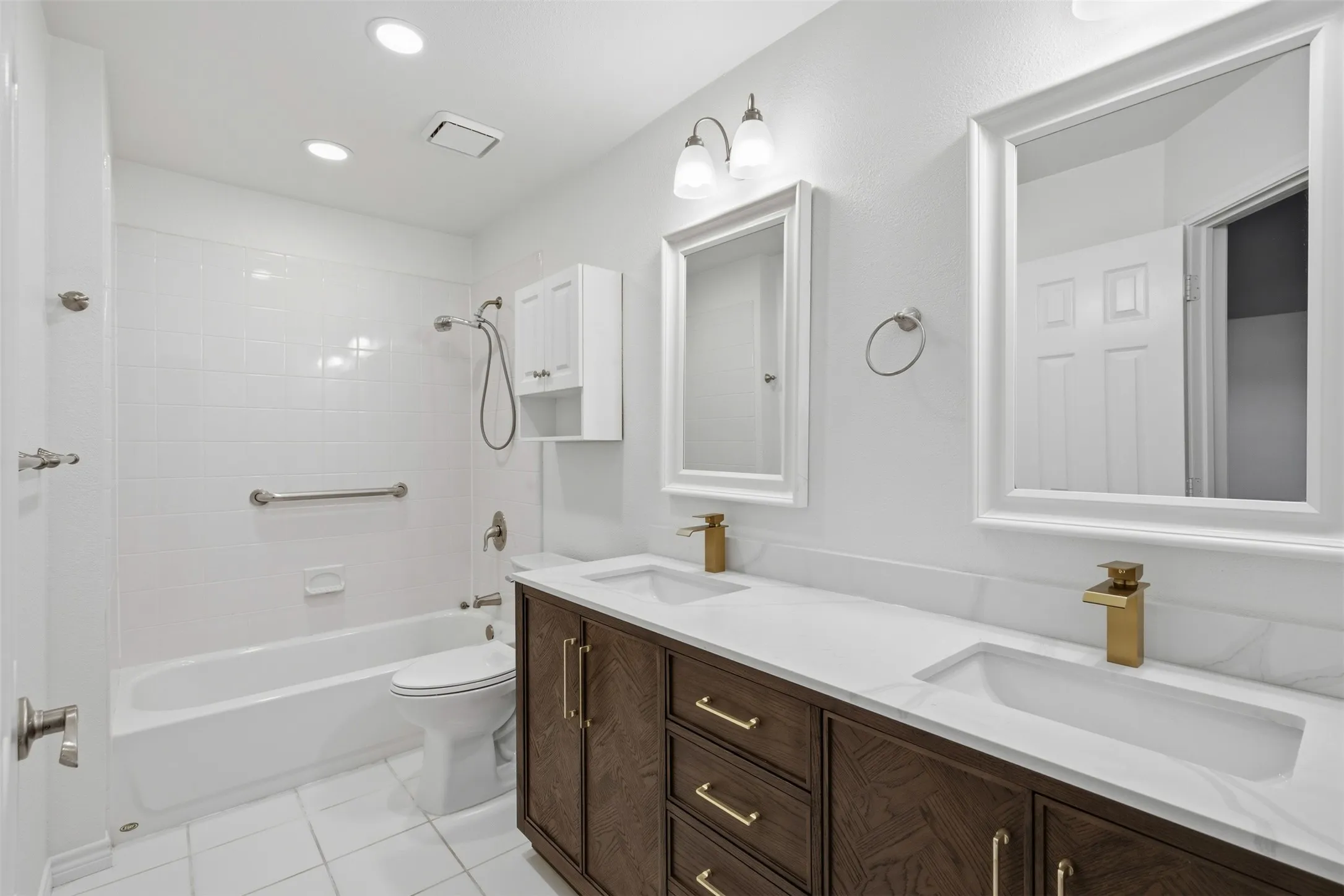 Dual vanity with integrated sinks and gold-tone fixtures