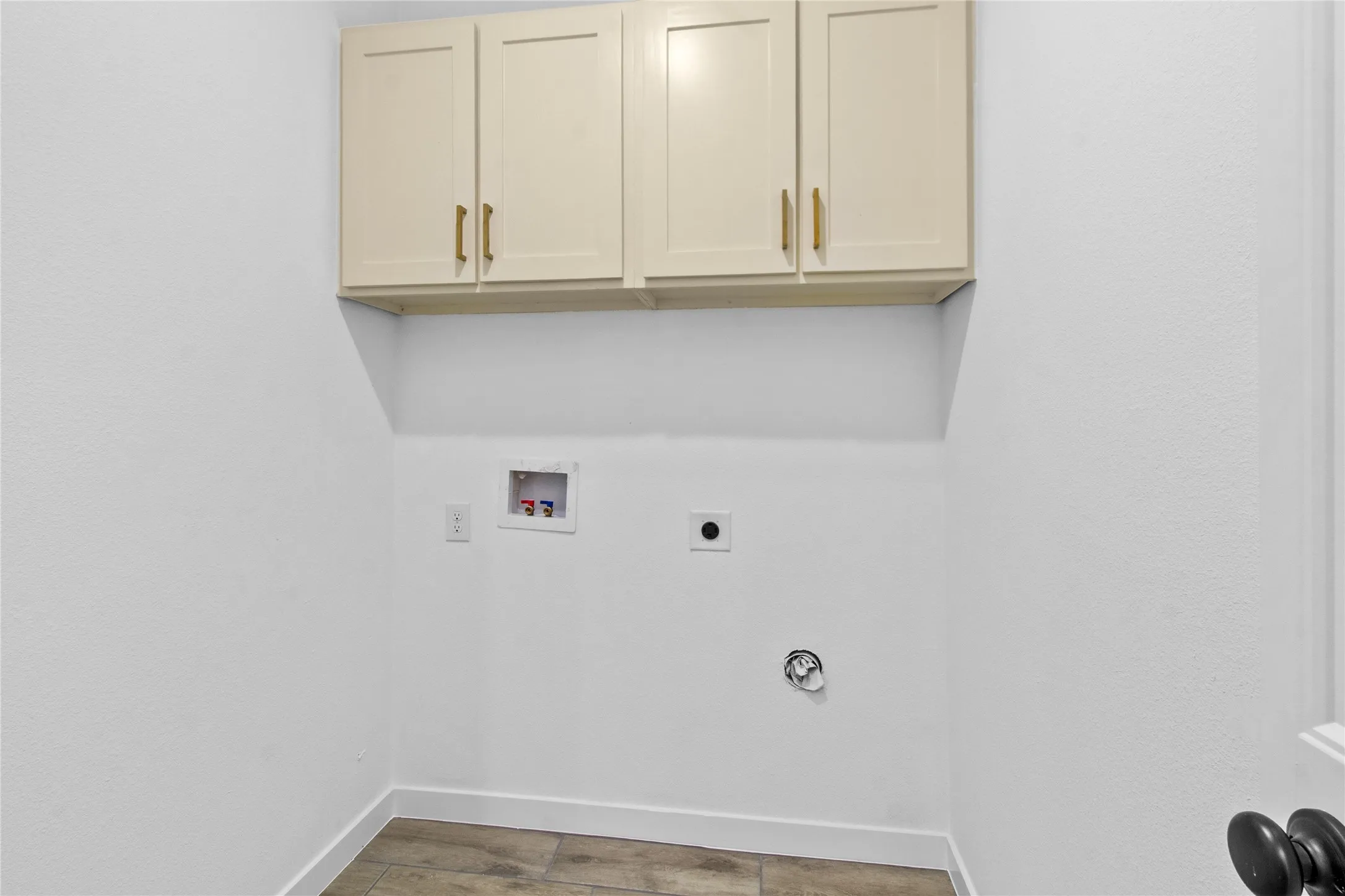 Built-in upper cabinetry with gold-tone hardware