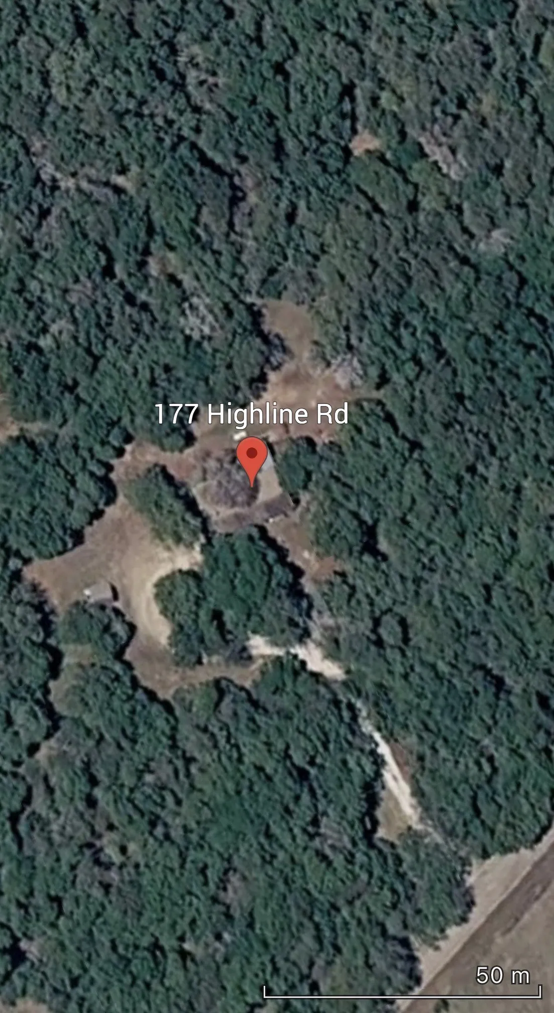 Aerial Property Survey. Satellite imagery depicting the location and site boundaries of the property at the specified address with a 50-meter scale reference