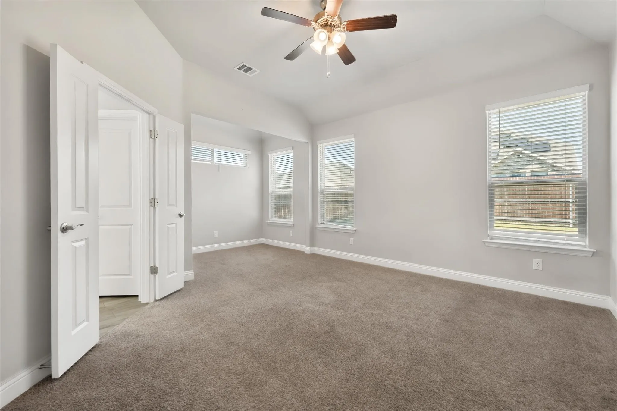 Primary bedroom is large with a separate seating area and ensuite bath