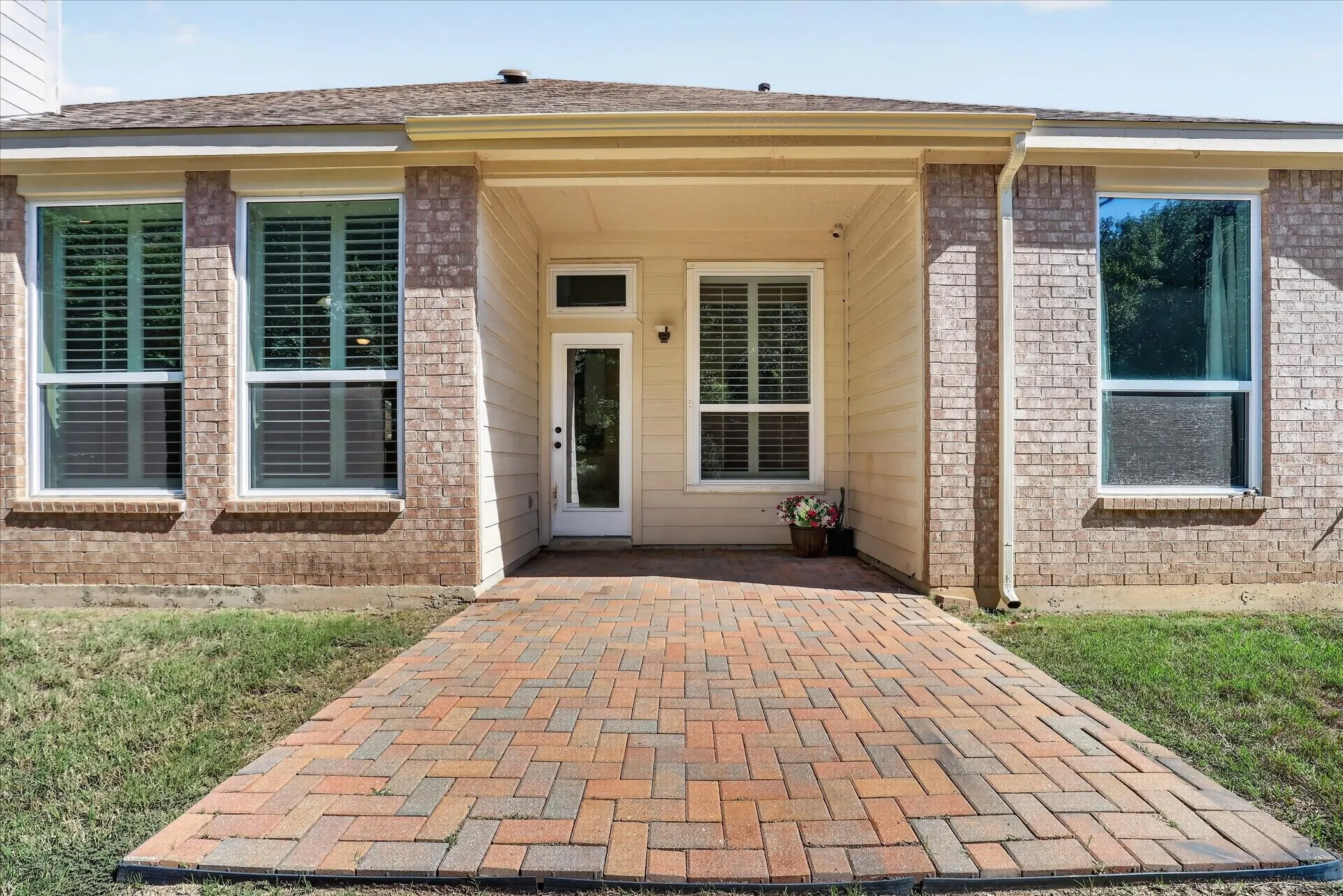 Brick exterior with light siding accents