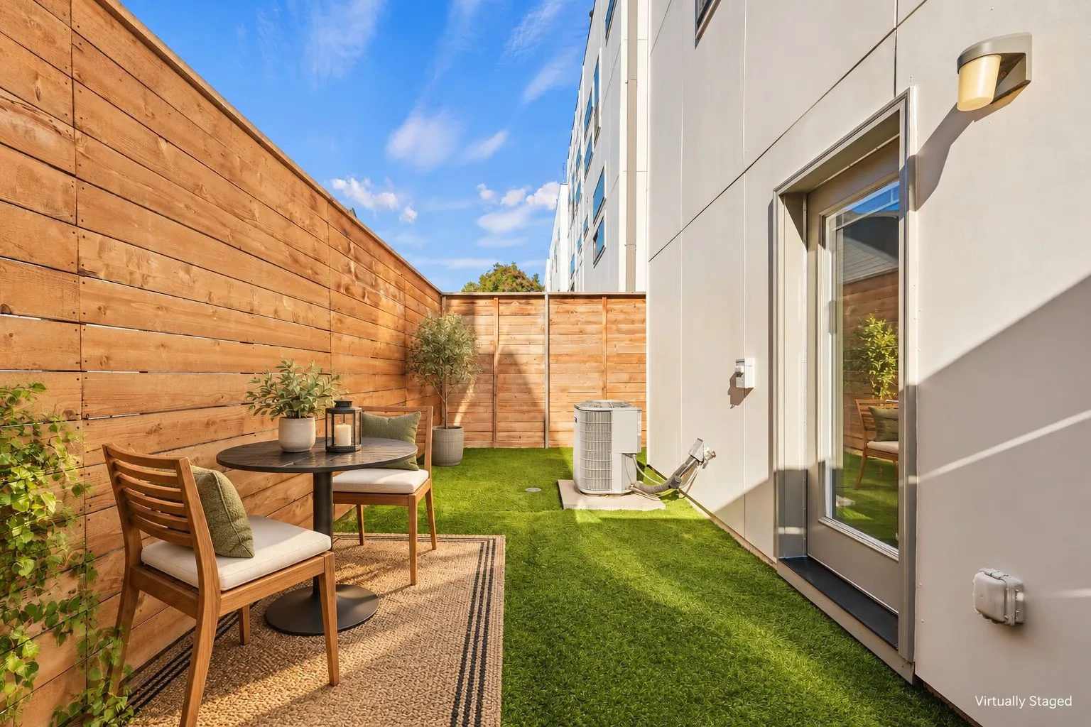 Turfed backyard with privacy fence