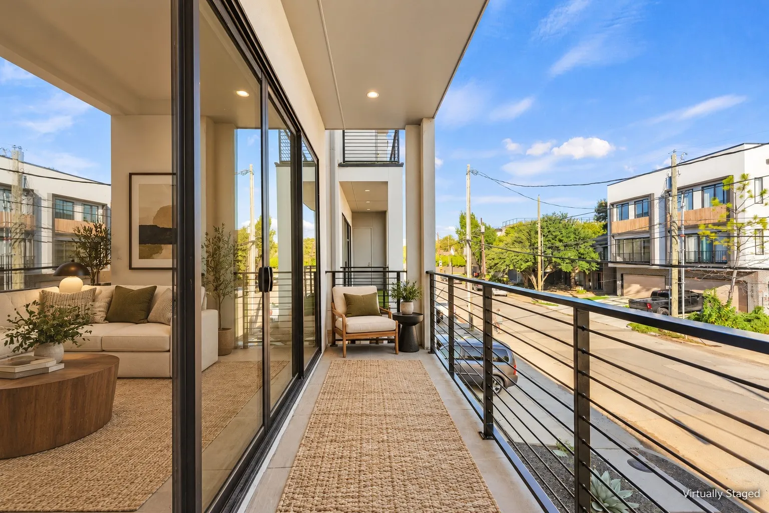 Sliding glass doors, open to covered balcony