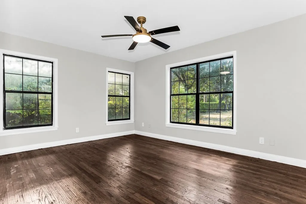 Second main-floor bedroom with hardwood floors