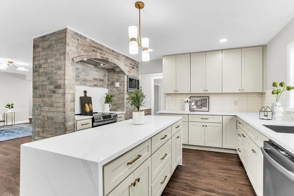 Kitchen island with drawer storage and brick range alcove