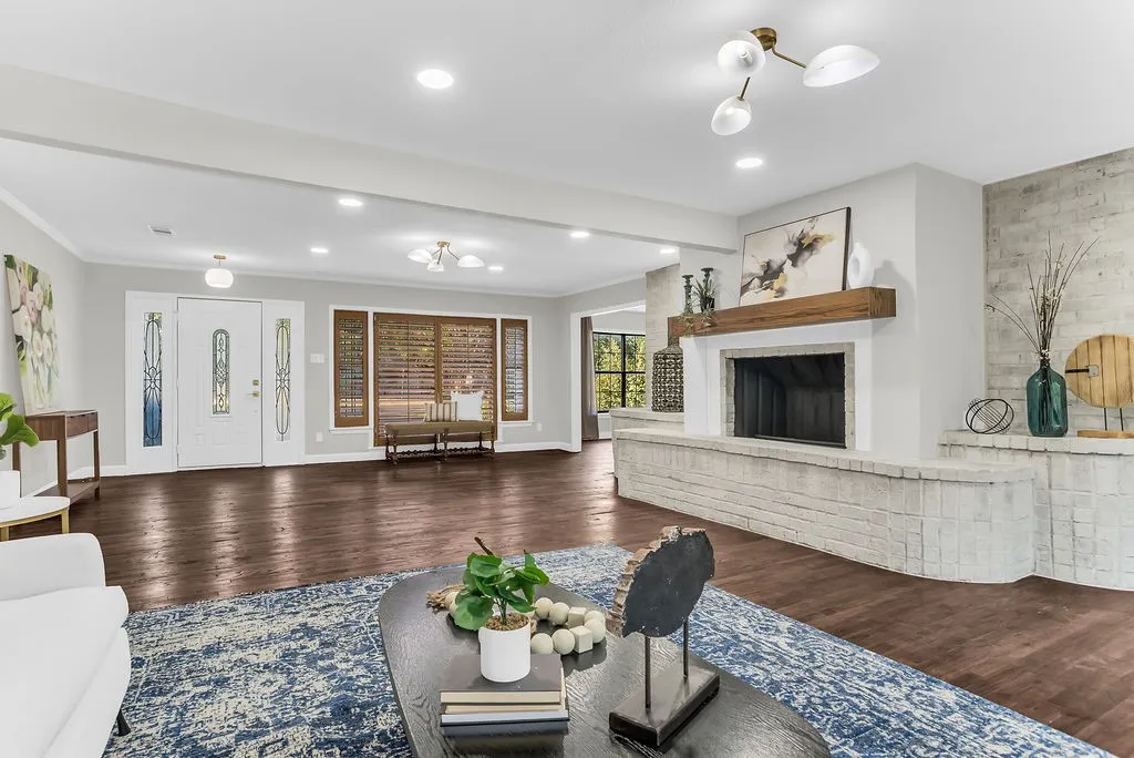 Great room open to the entry, dining room and patio doors