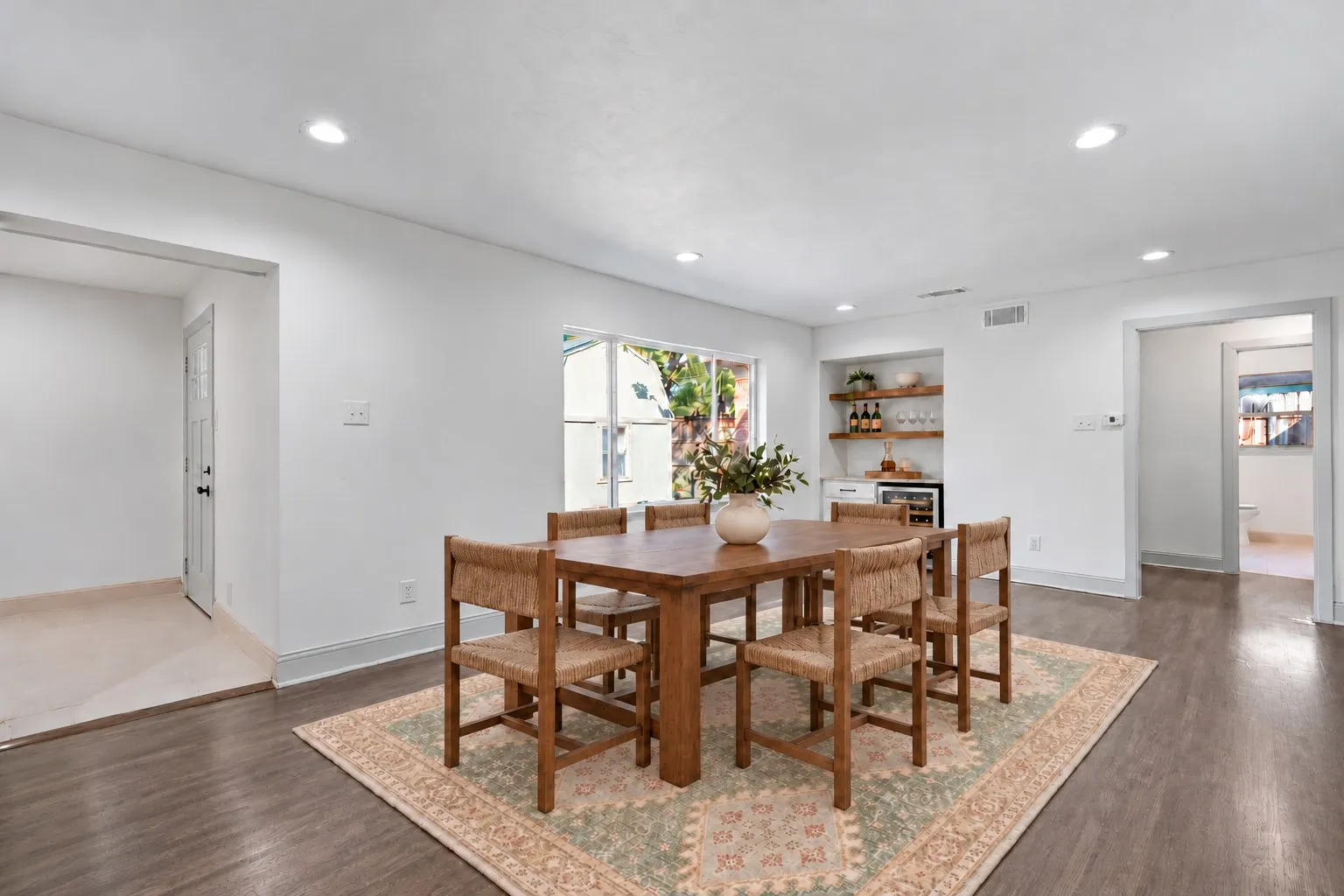 Virtually staged dining area and dry bar