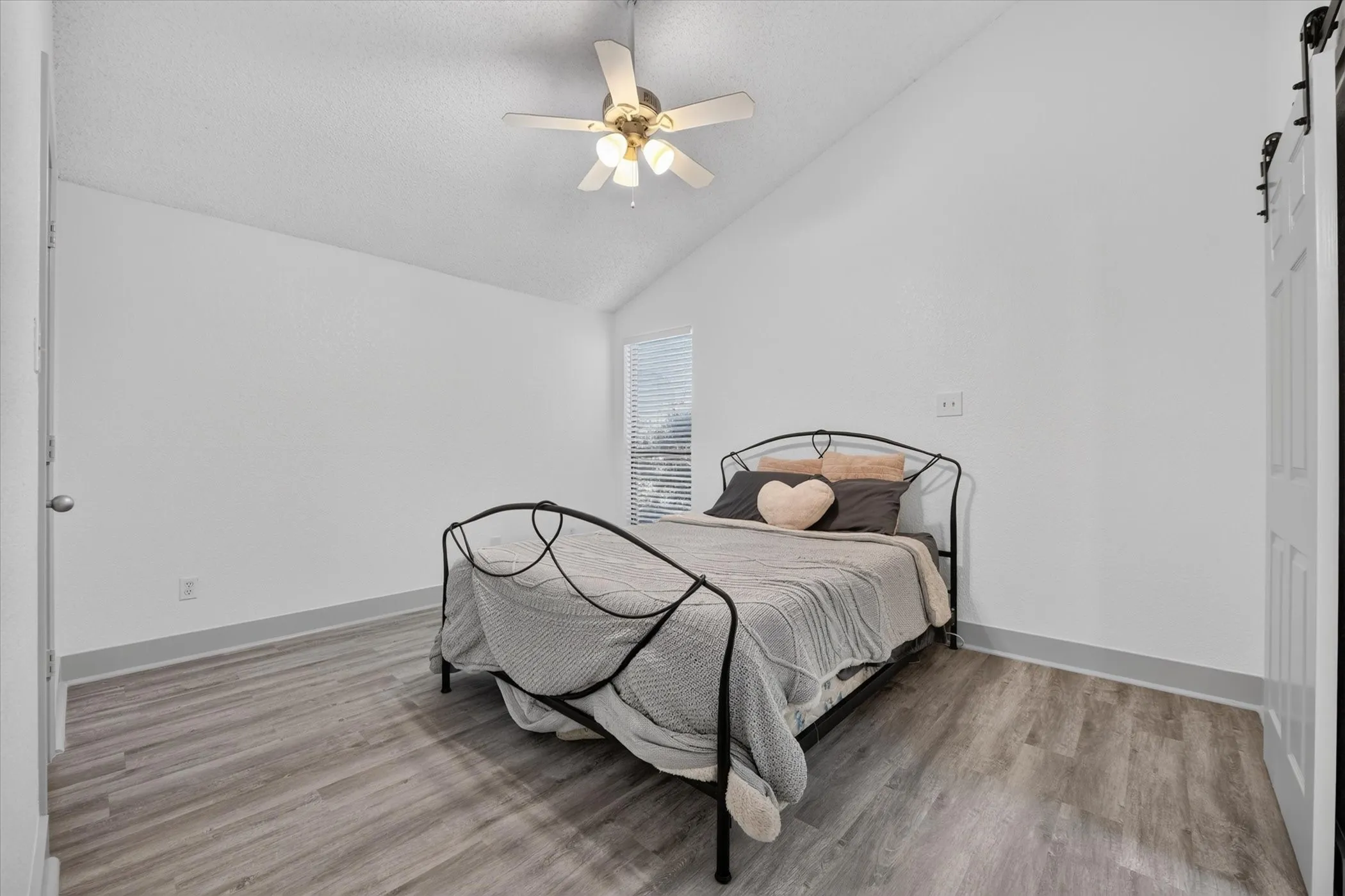 Large primary bedroom with vaulted ceilings make this a great space to call home