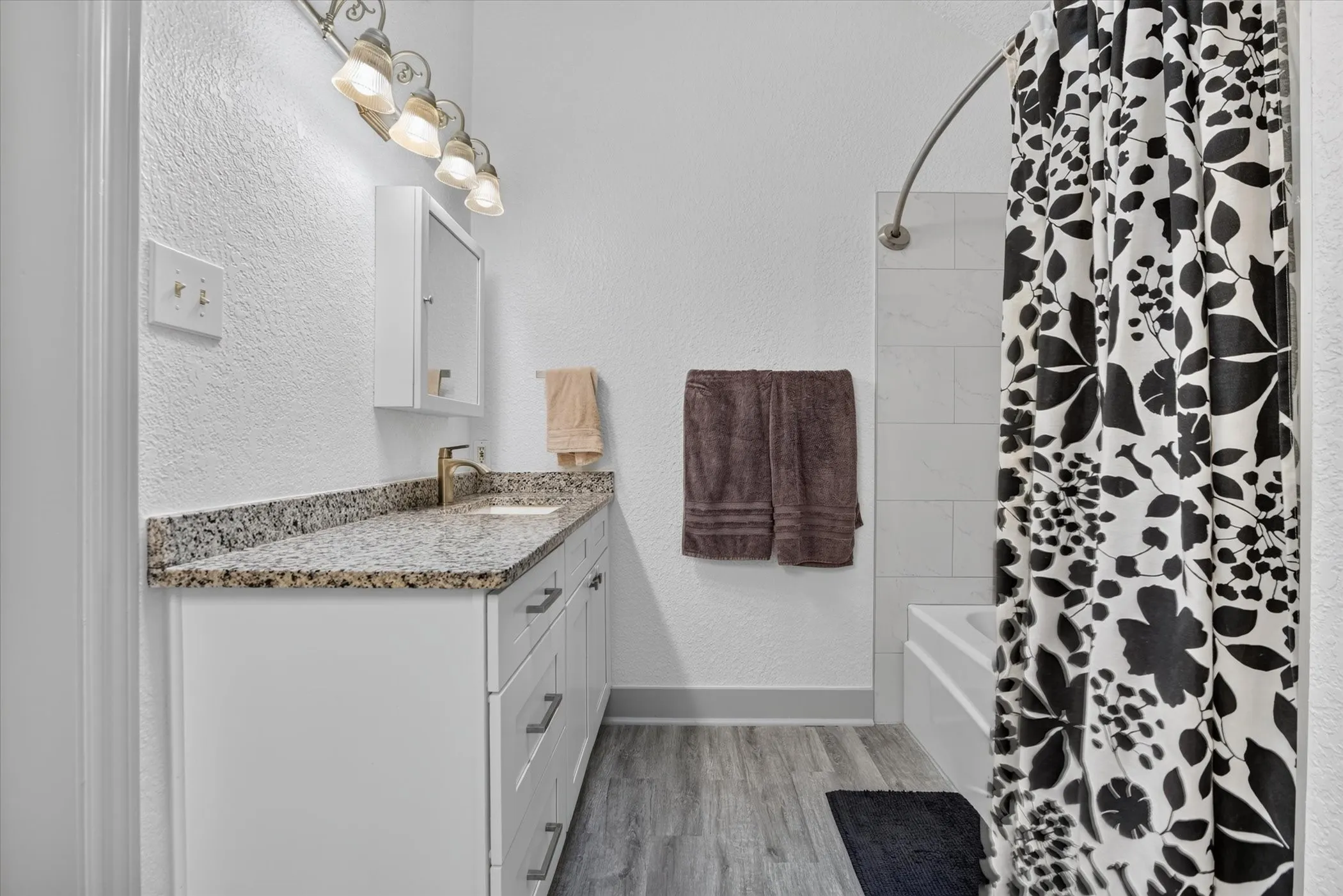 Large primary bathroom with dual vanities