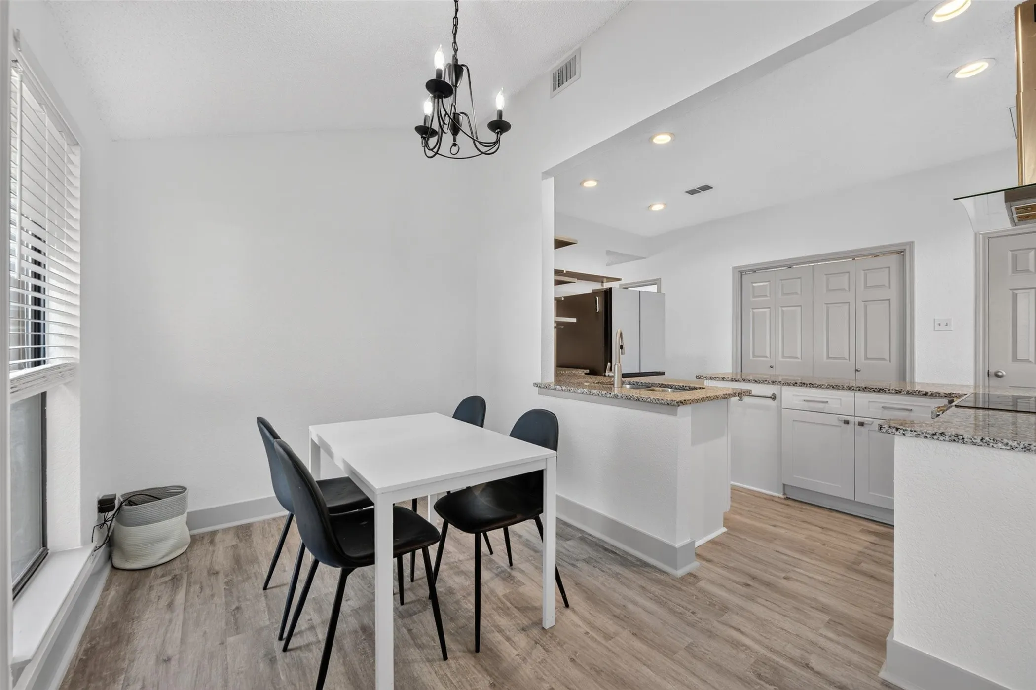 The dining room offers an open, airy feel with an easy connection to the kitchen, making mealtime and entertaining effortless