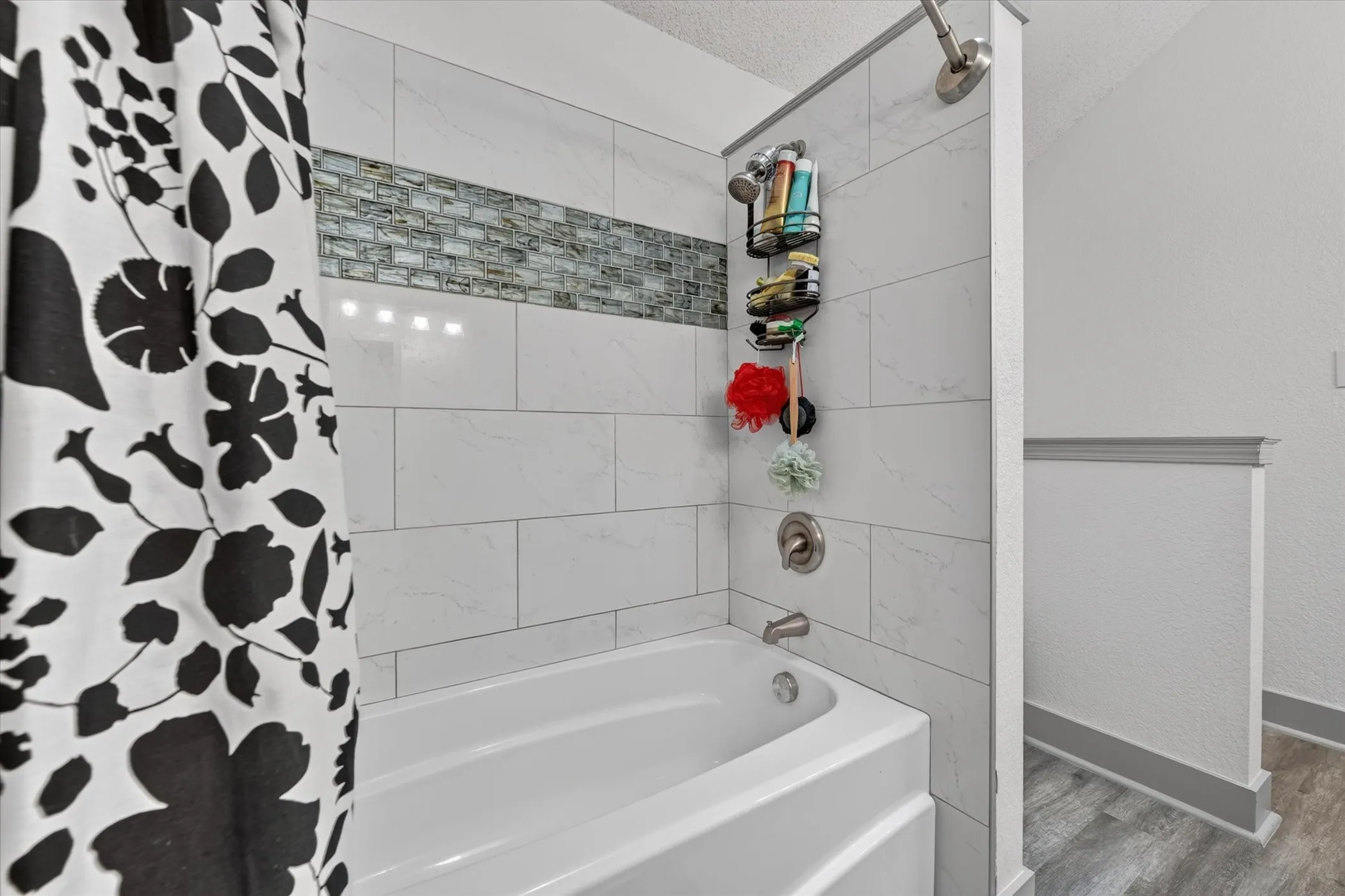 Large primary bathroom with dual vanities and large tub