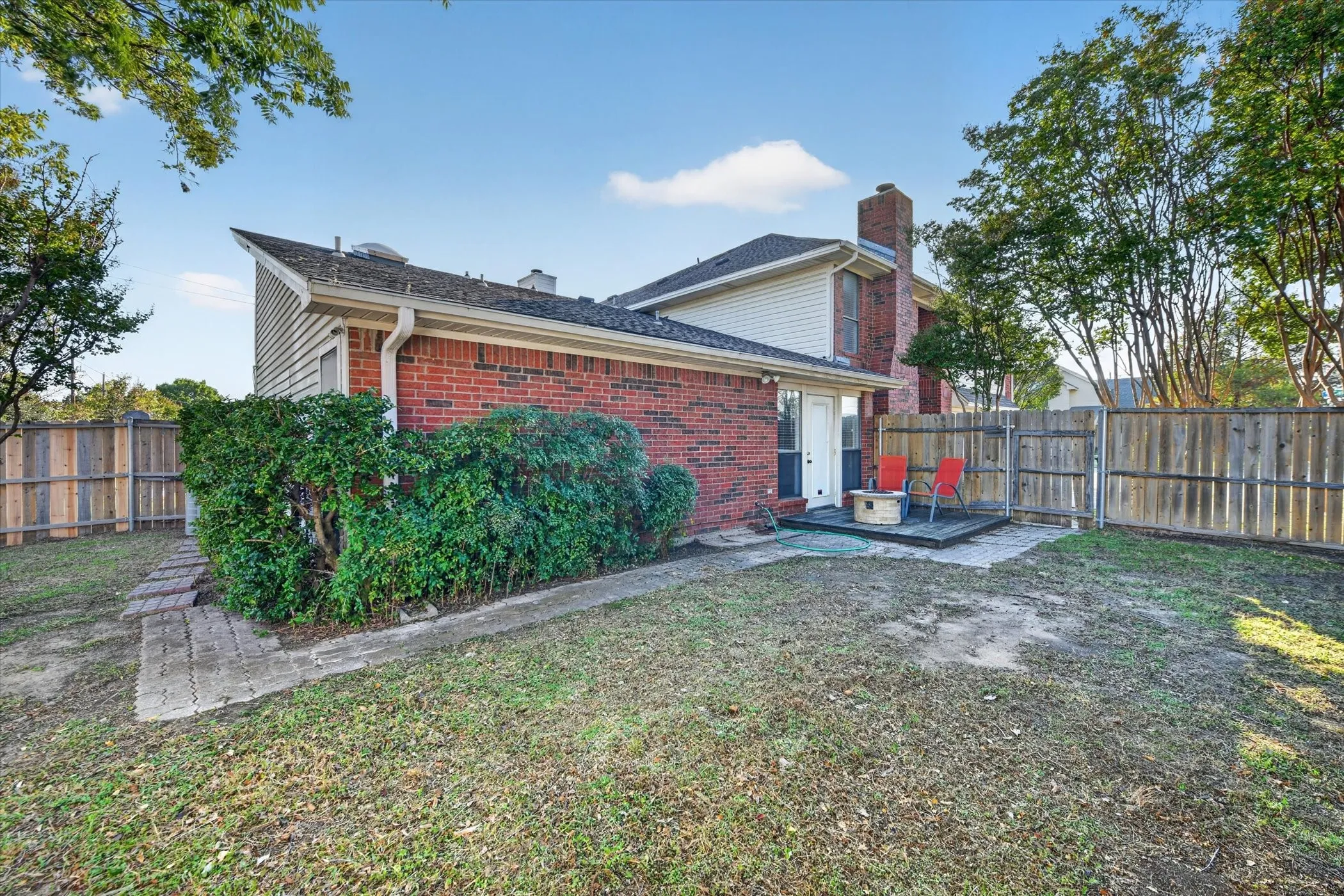 Large backyard space with access from the house and the driveway
