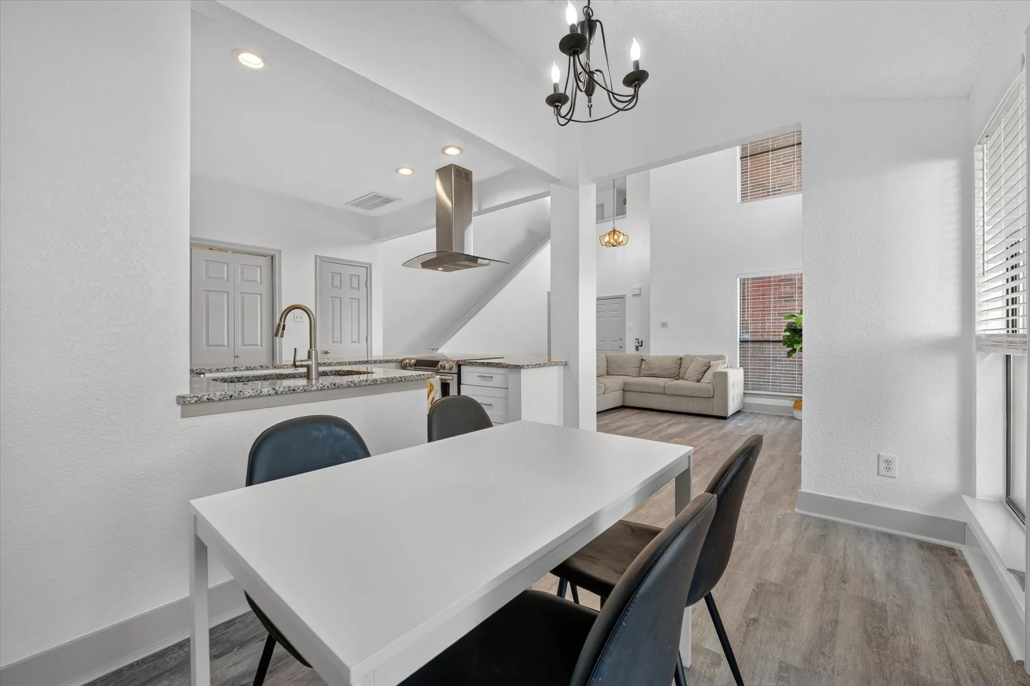 Natural light pours through the windows, brightening the dining area and enhancing its open flow into the kitchen.