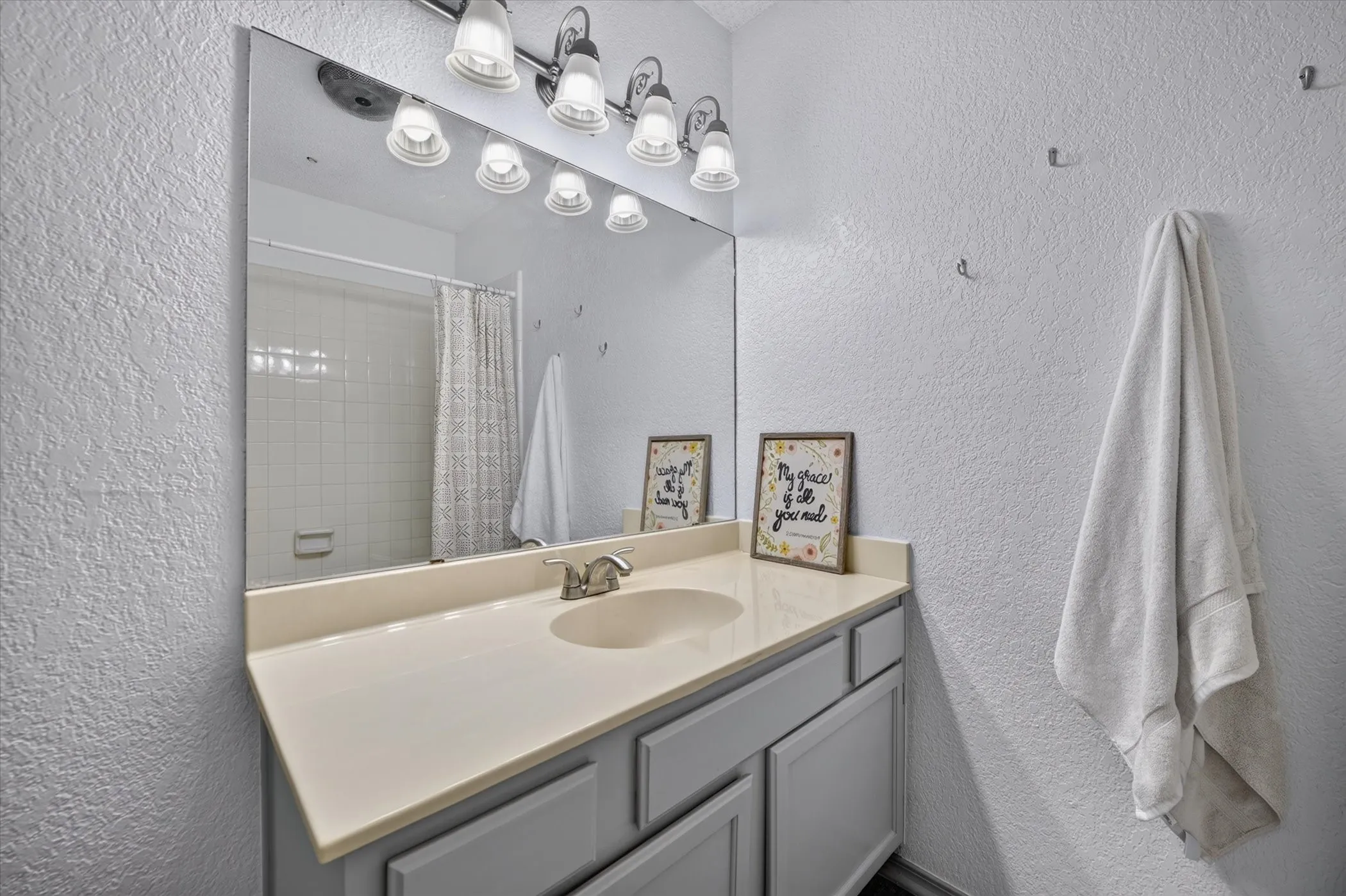 Fresh paint and flooring in the bathrooms give this space a clean and modern feel