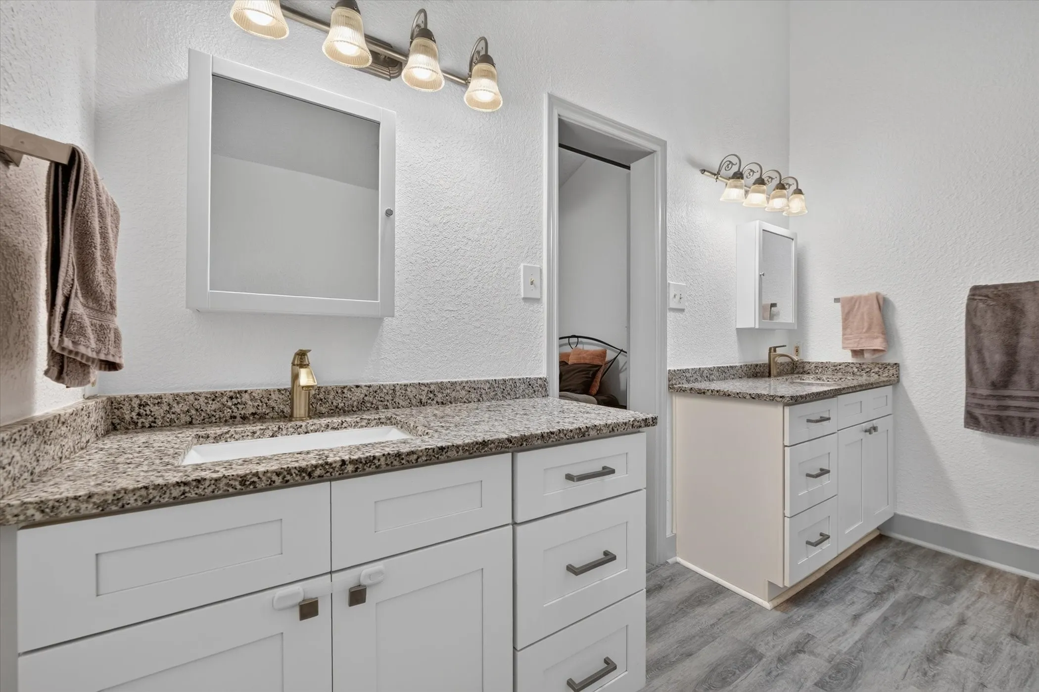 Large primary bathroom with dual vanities