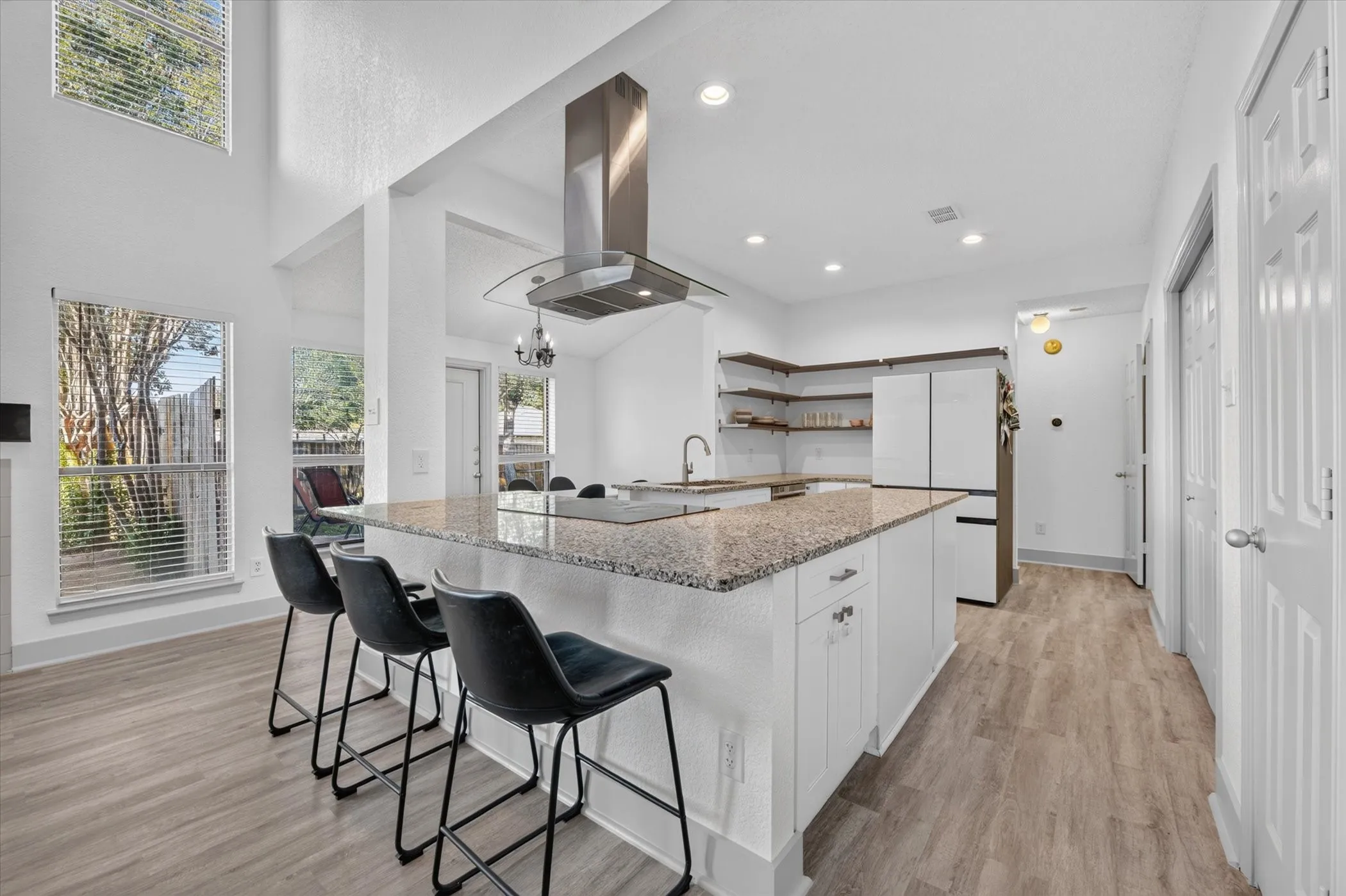 The convenient breakfast bar offers additional seating and a perfect spot for casual dining, morning coffee, or gathering with guests