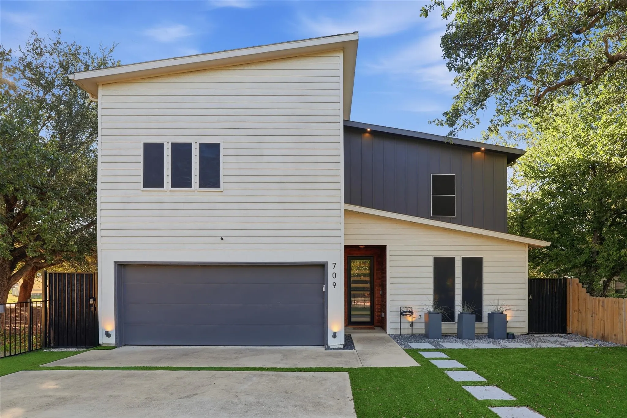 Modern exterior with an asymmetrical roofline and horizontal siding