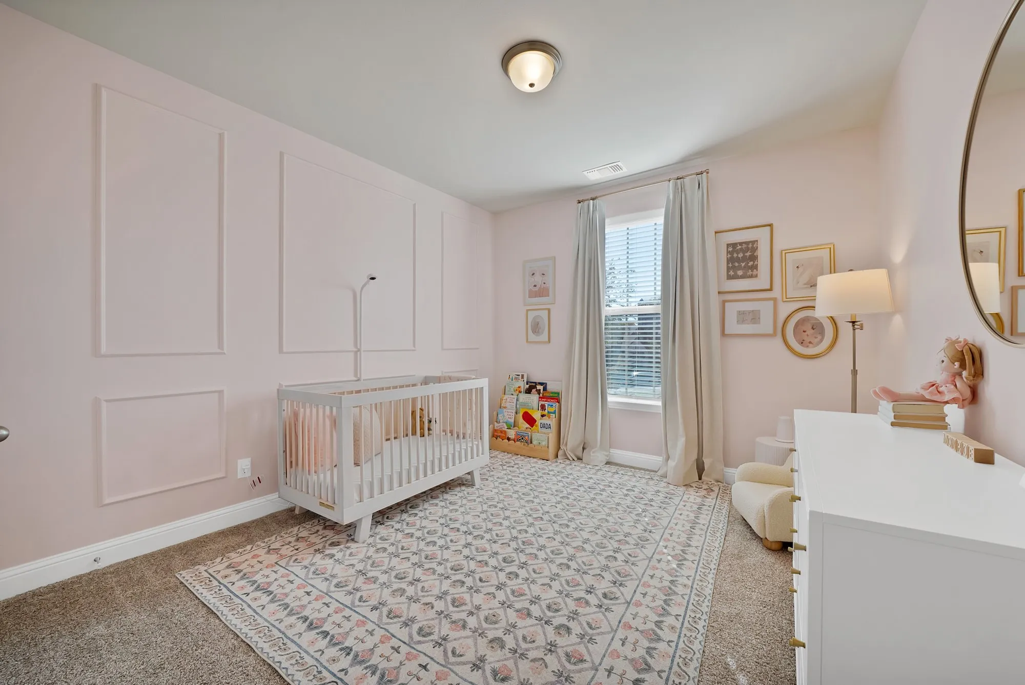 Wall paneling with decorative molding, flush-mount ceiling light, window with blinds, and neutral carpeting