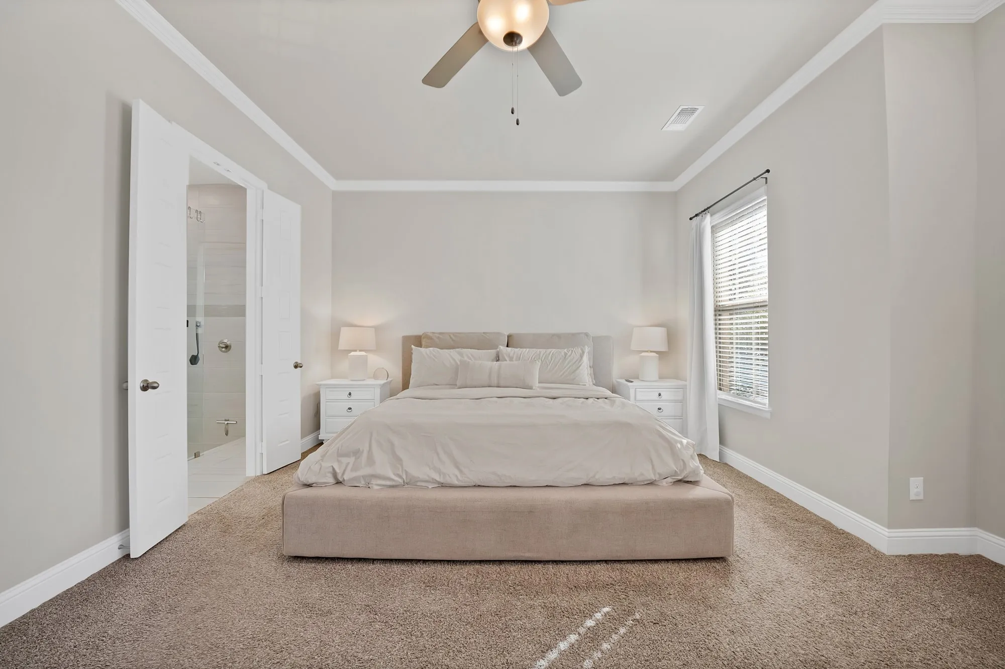 Neutral wall tones, crown molding, and a ceiling fan with integrated lighting