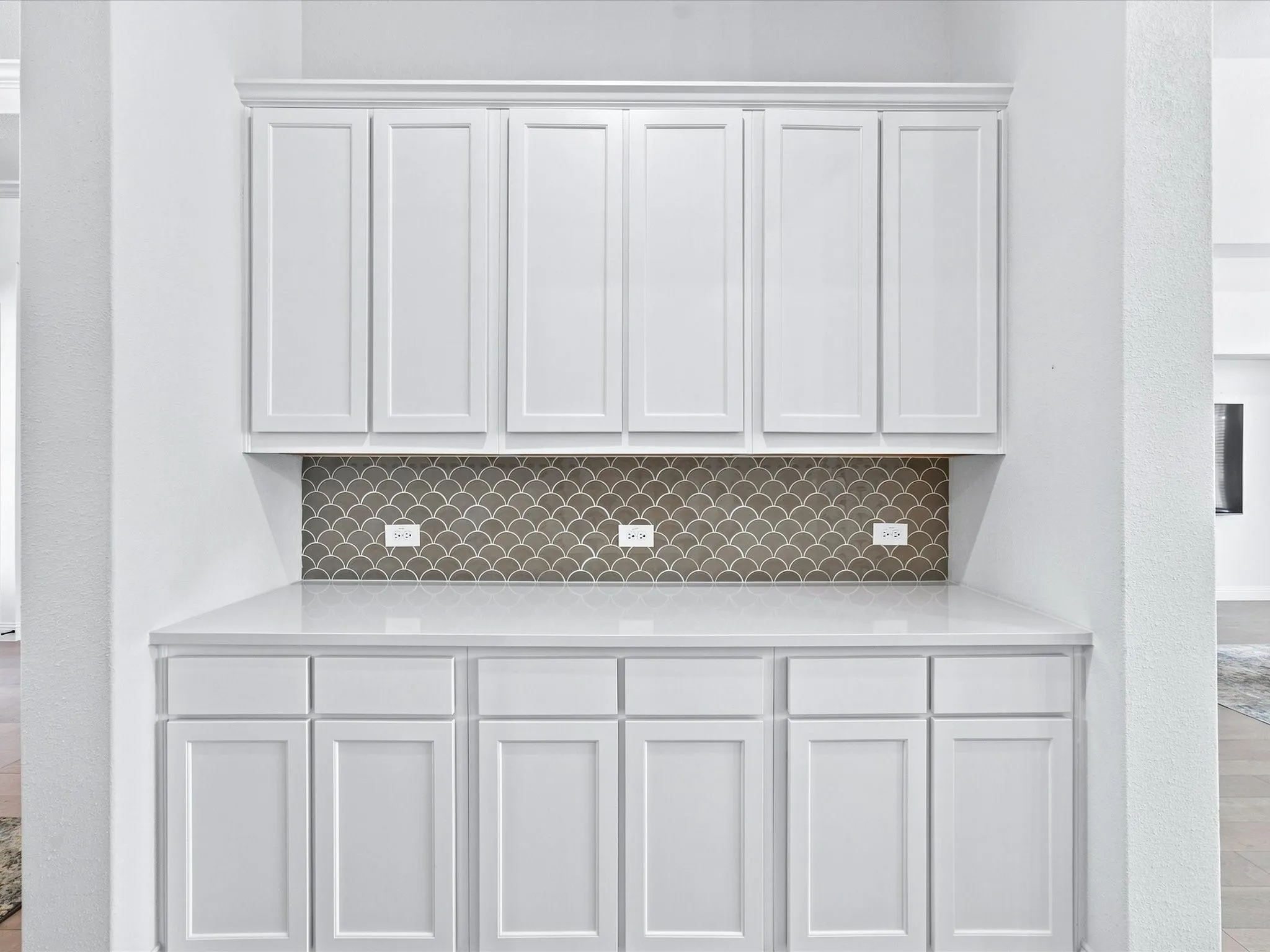 Dry bar in Kitchen with abundant cabinetry