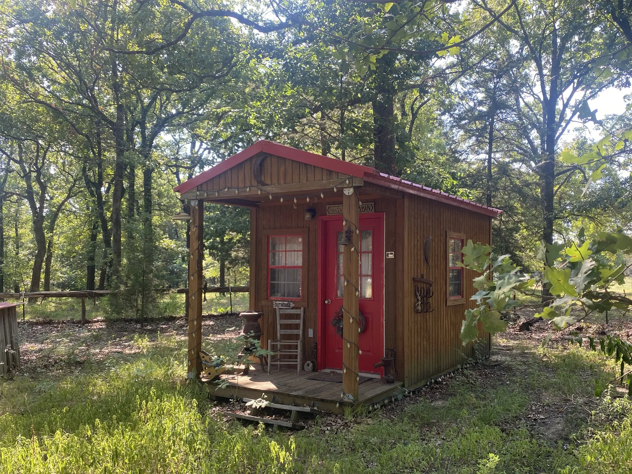 Wood structure featuring a covered porch with a wood deck.