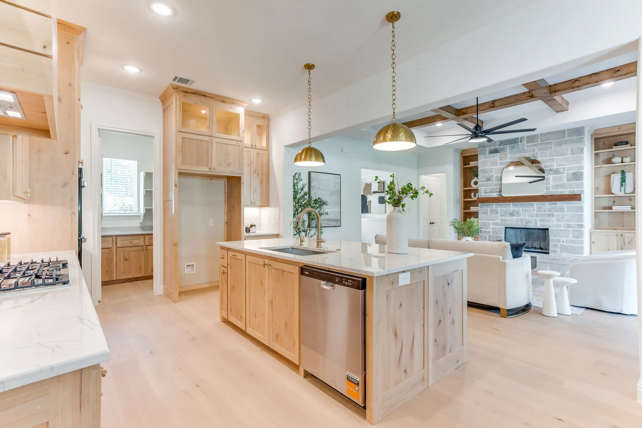Kitchen with Quartzite countertops, 36" gas cooktop, plumbed for gas-propane, custom cabinetry to the ceiling and a butler pantry