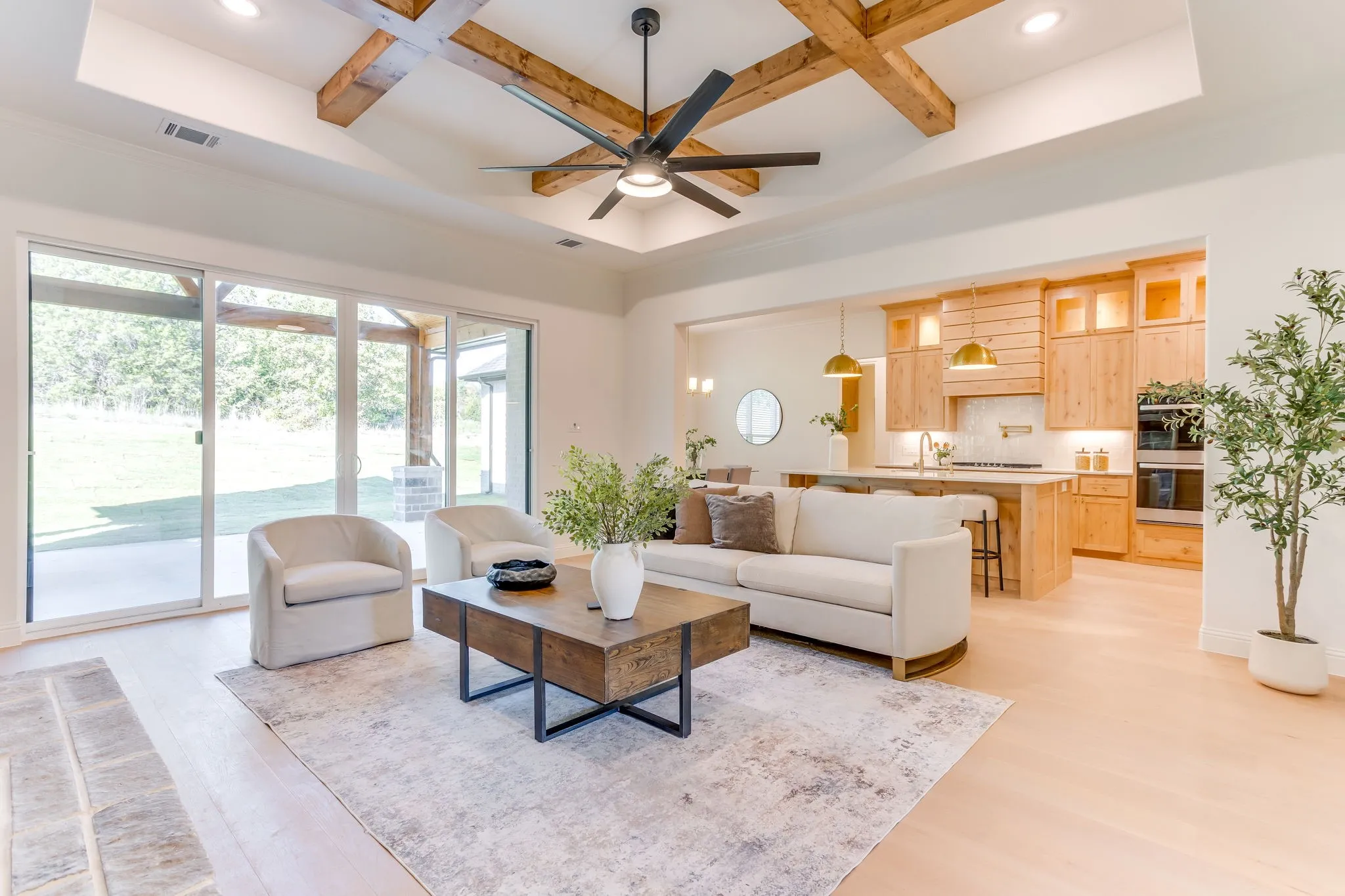 Tray ceiling with wood beam detailing and fan