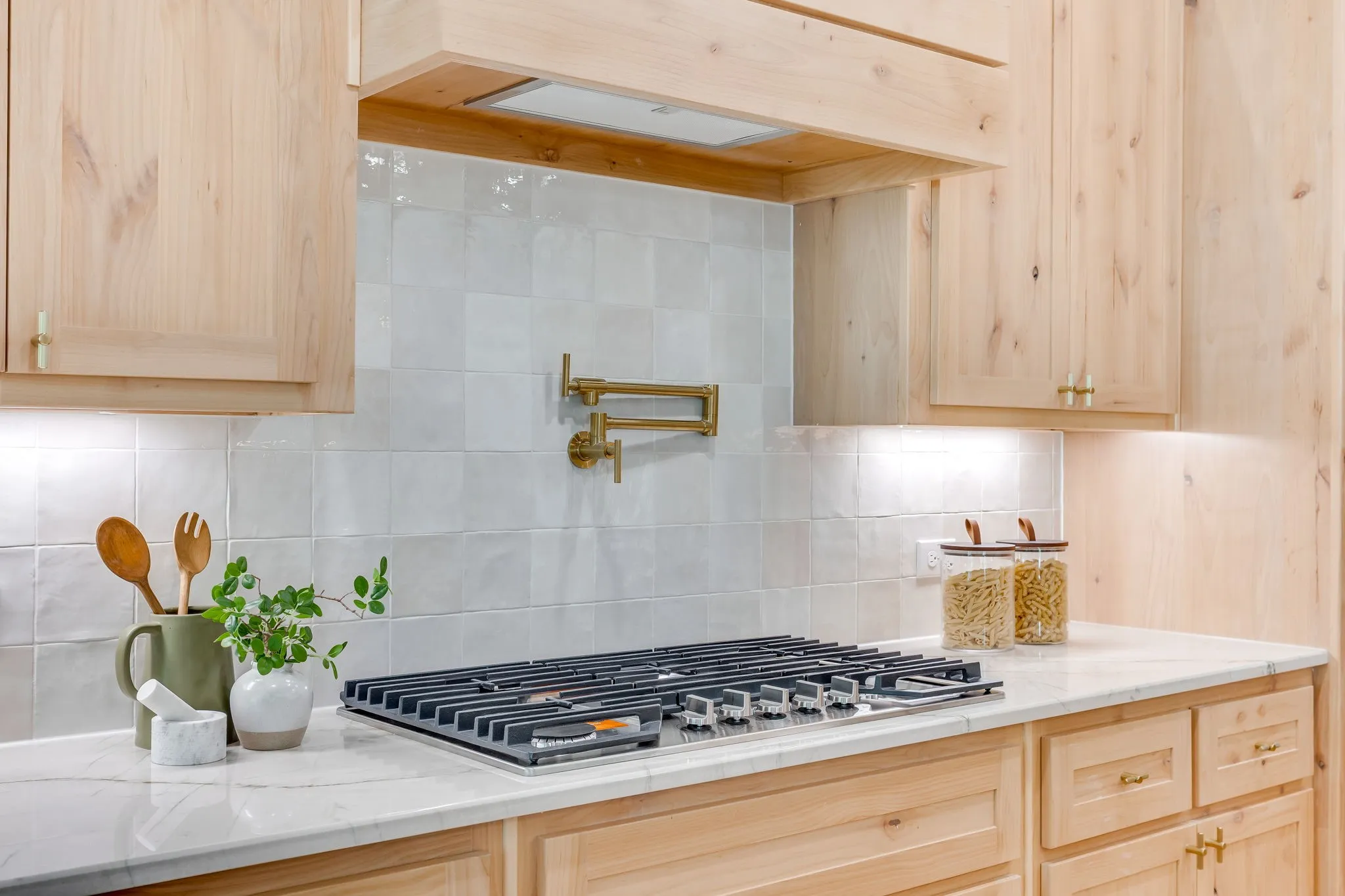 Kitchen with Quartzite countertops, 36" gas cooktop, plumbed for gas-propane, custom cabinetry to the ceiling and a butler pantry