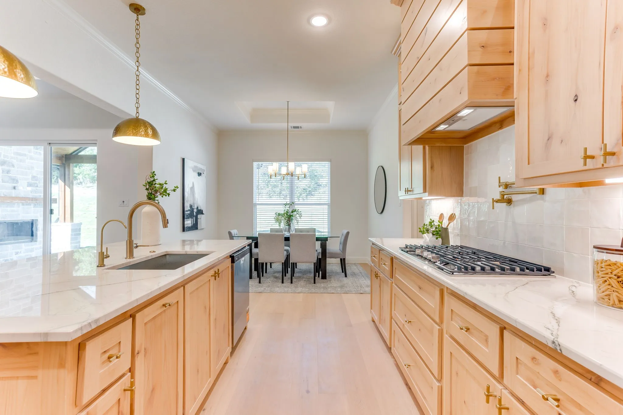 LKitchen with Quartzite countertops, 36" gas cooktop, plumbed for gas-propane, custom cabinetry to the ceiling and a butler pantry