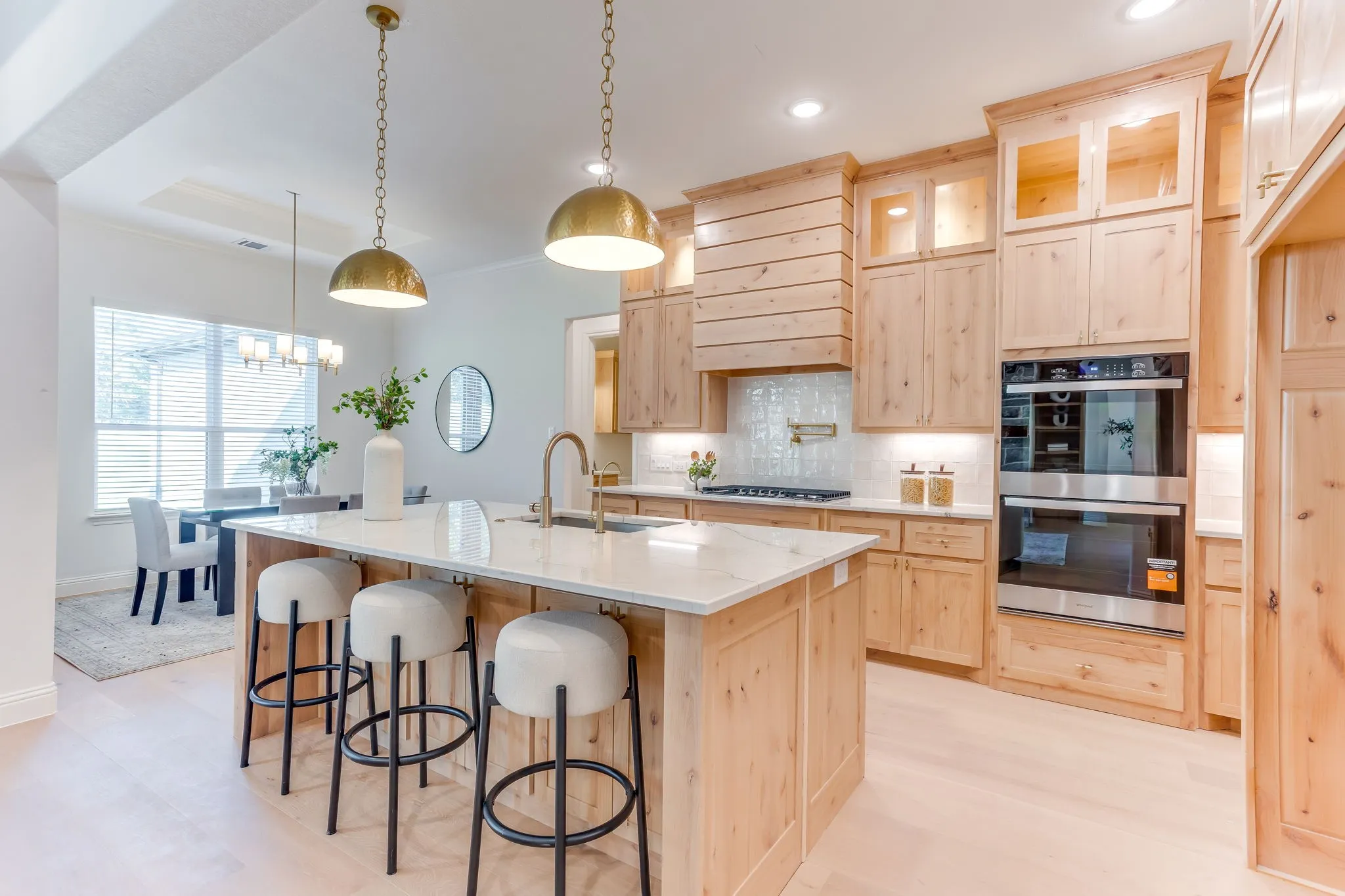 Kitchen with Quartzite countertops, 36" gas cooktop, plumbed for gas-propane, custom cabinetry to the ceiling and a butler pantry