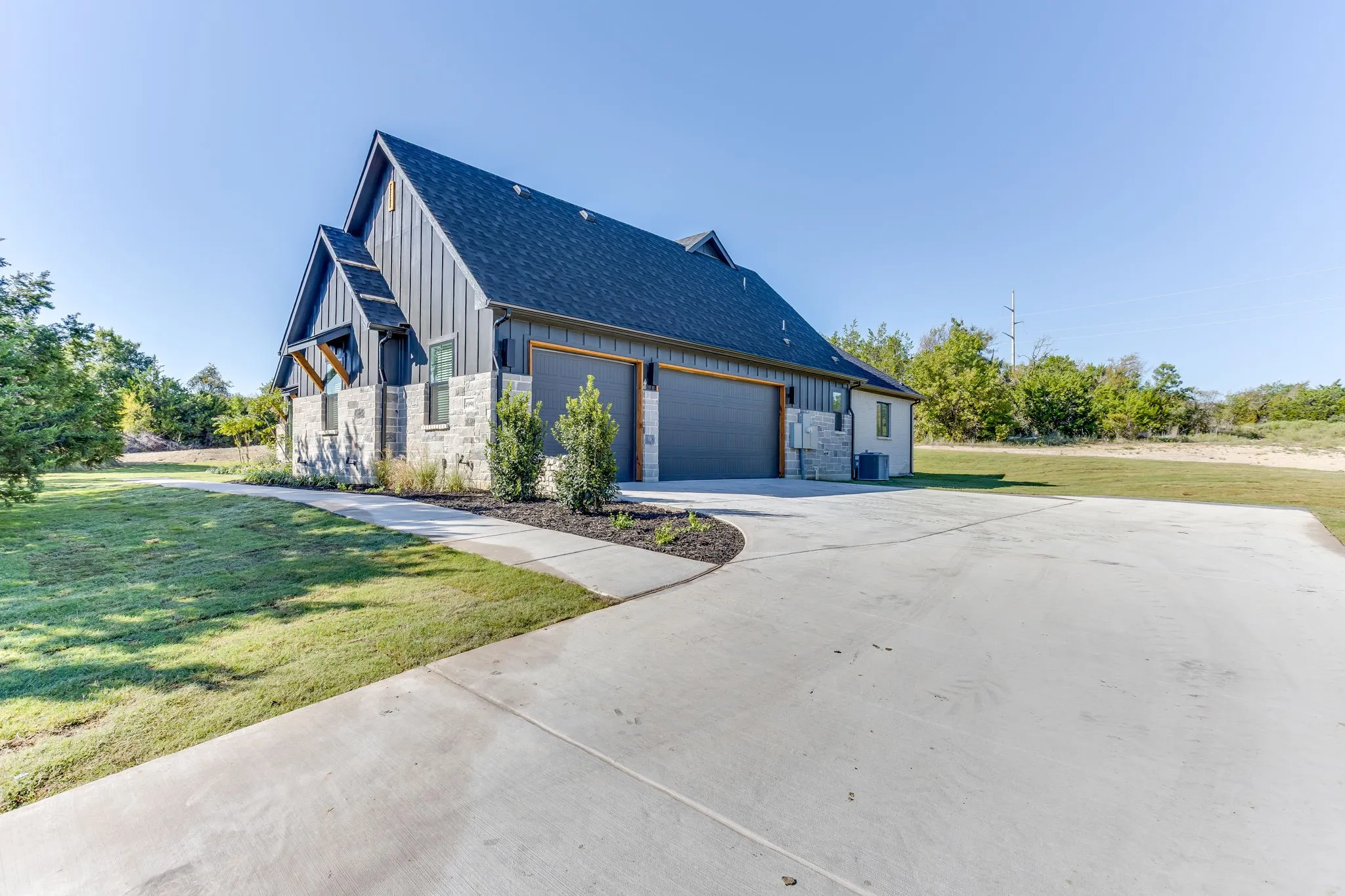 Oversized 3 car garage with custom epoxy floors